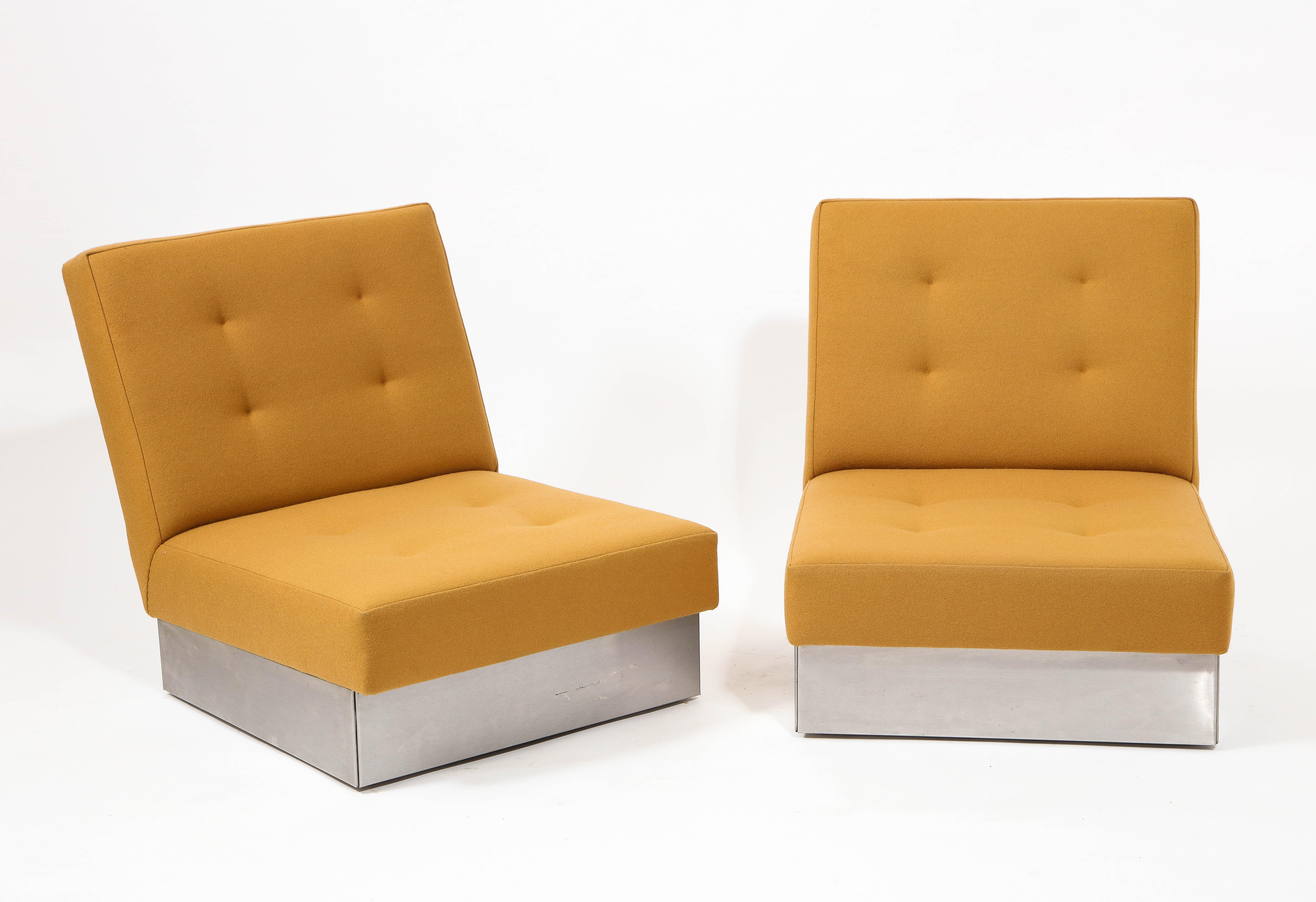 Classic 70's slipper chairs by Jacques Charpentier for Roche & Bobois, upholstered in Maharam wool over a brushed stainless steel base. Note the low seat height. Another set is available for COM.