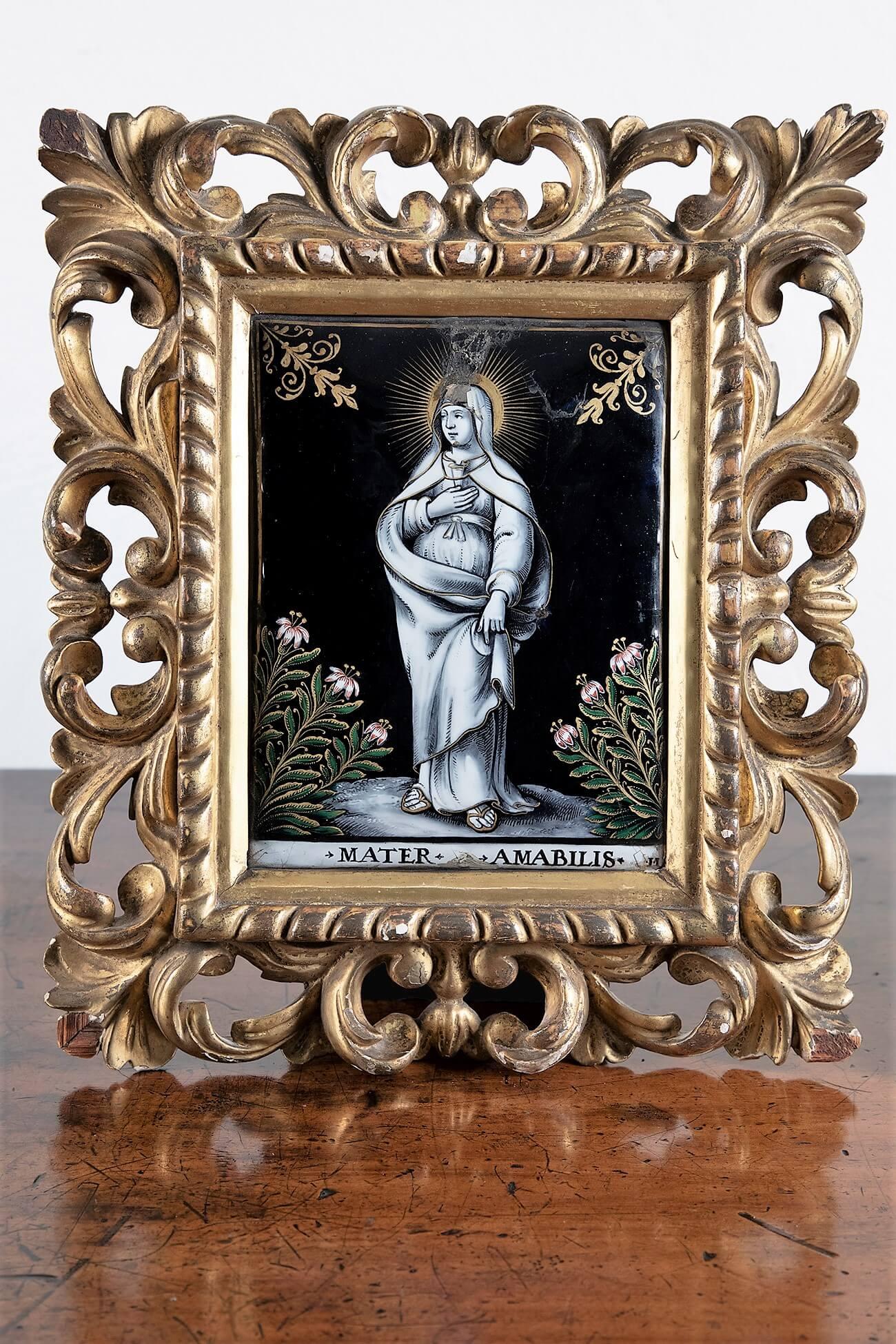 A captivating pair of 17th-century Limoges enamel plaques by Jacques Laudin II of the renowned Laudin family dynasty of enamellers. Entitled ‘Jesus Amabilis’ and ‘Mater Amabilis’ featuring noir backgrounds, gold highlighting and decorative