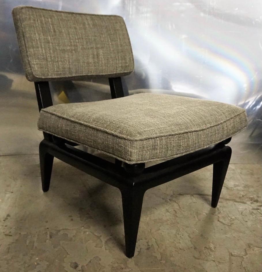 Elegant pair of newly upholstered in a nubby gray fabric James Mont bench made chairs. A matching pair.
The legs are tapered down and very stylish. Age appropriate wear, circa 1950s.