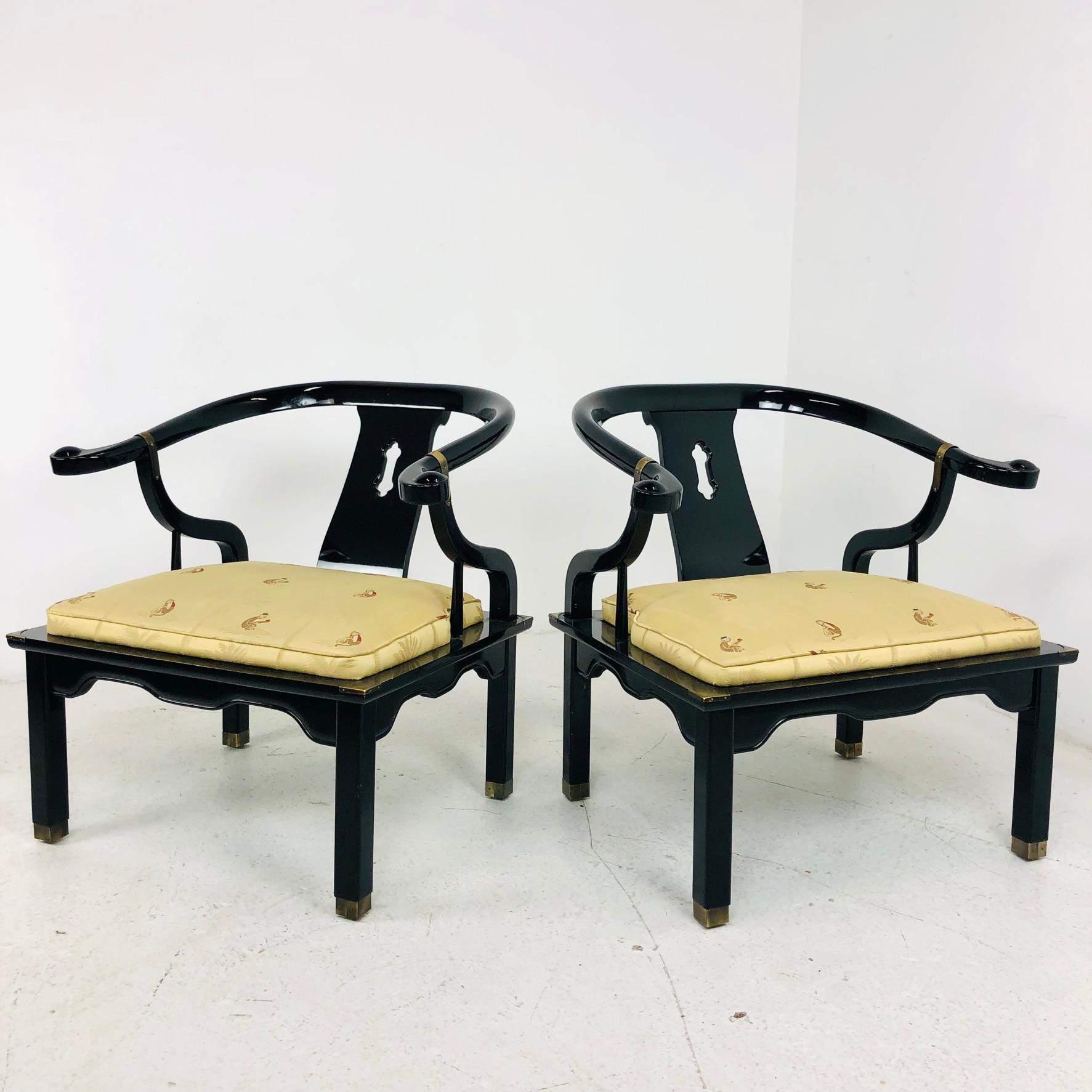 Pair of James Mont horseshoe Ming style armchairs. Features solid wood construction and beautiful high gloss finish. Circa mid-20th century.