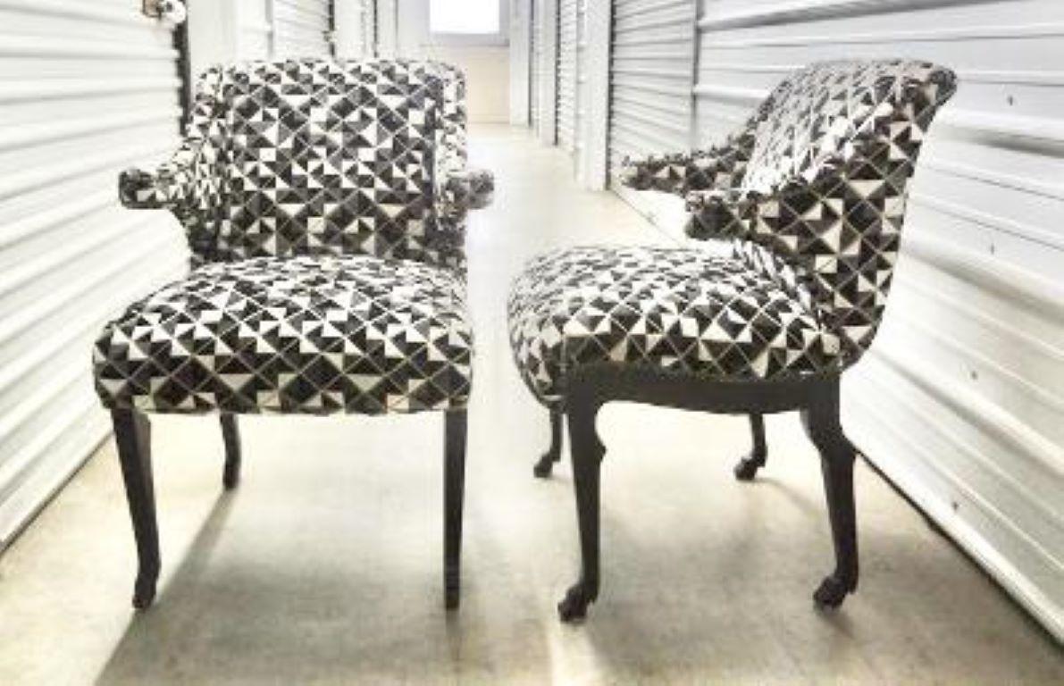 Pair of Grosfeld House Etruscan Style Ebonized Lounge Chairs with Hoof Feet.
Stunning pair of mid-century John Dickinson inspired ebonized lounge chairs with hoof feet. These unique armchairs have been professionally upholstered in a designer