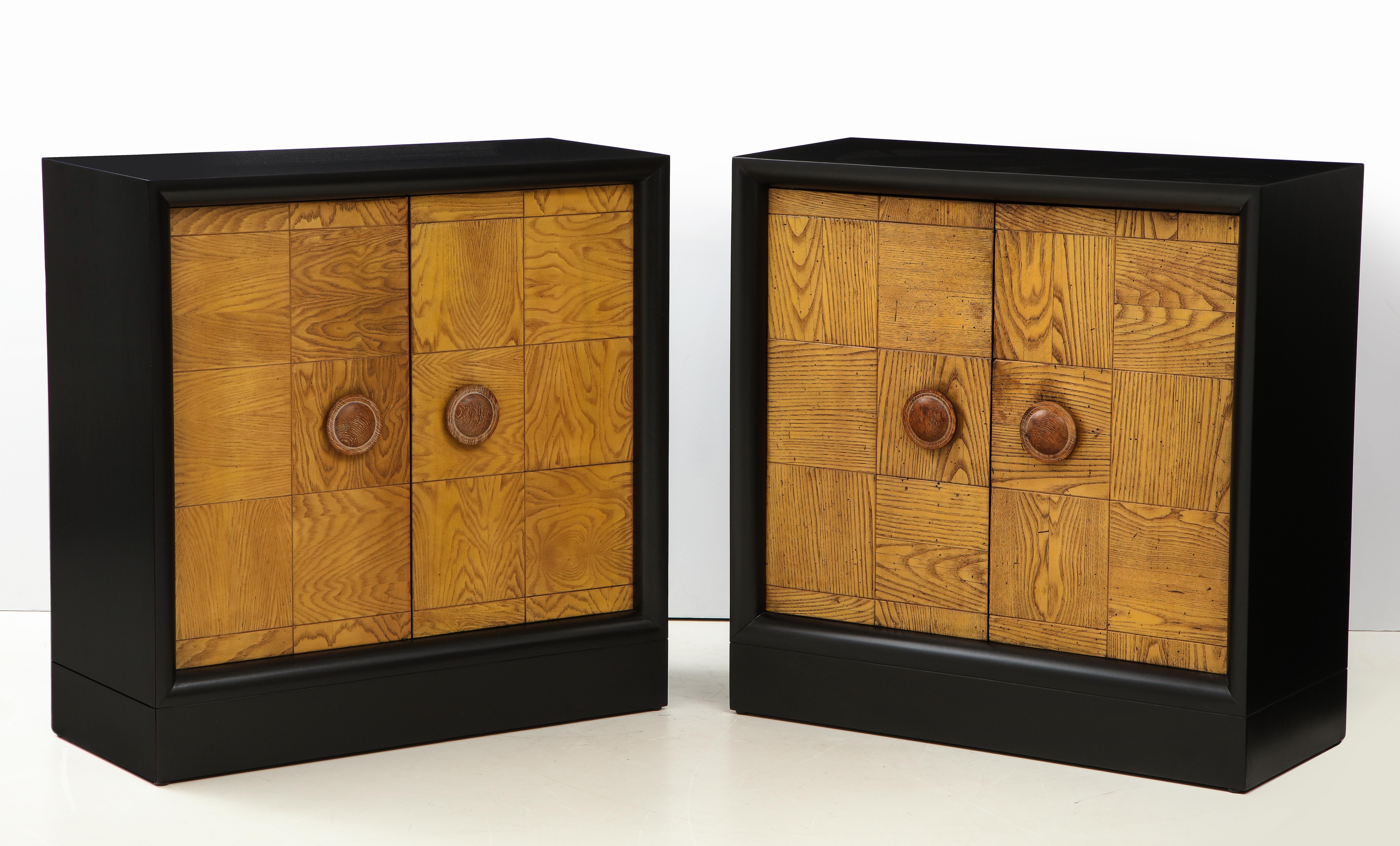 Stunning pair of cabinets by James Mont.
The newly refinished black satin cabinets are set off by wonderful oak patchwork door fronts.
One cabinet has four interior drawers and the other has a single shelf.