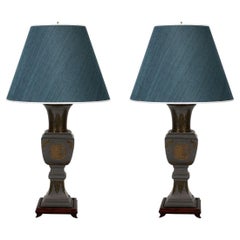 Pair of James Mont Style Brass and Bronze Lamps With Raised Asian Motif Detail a