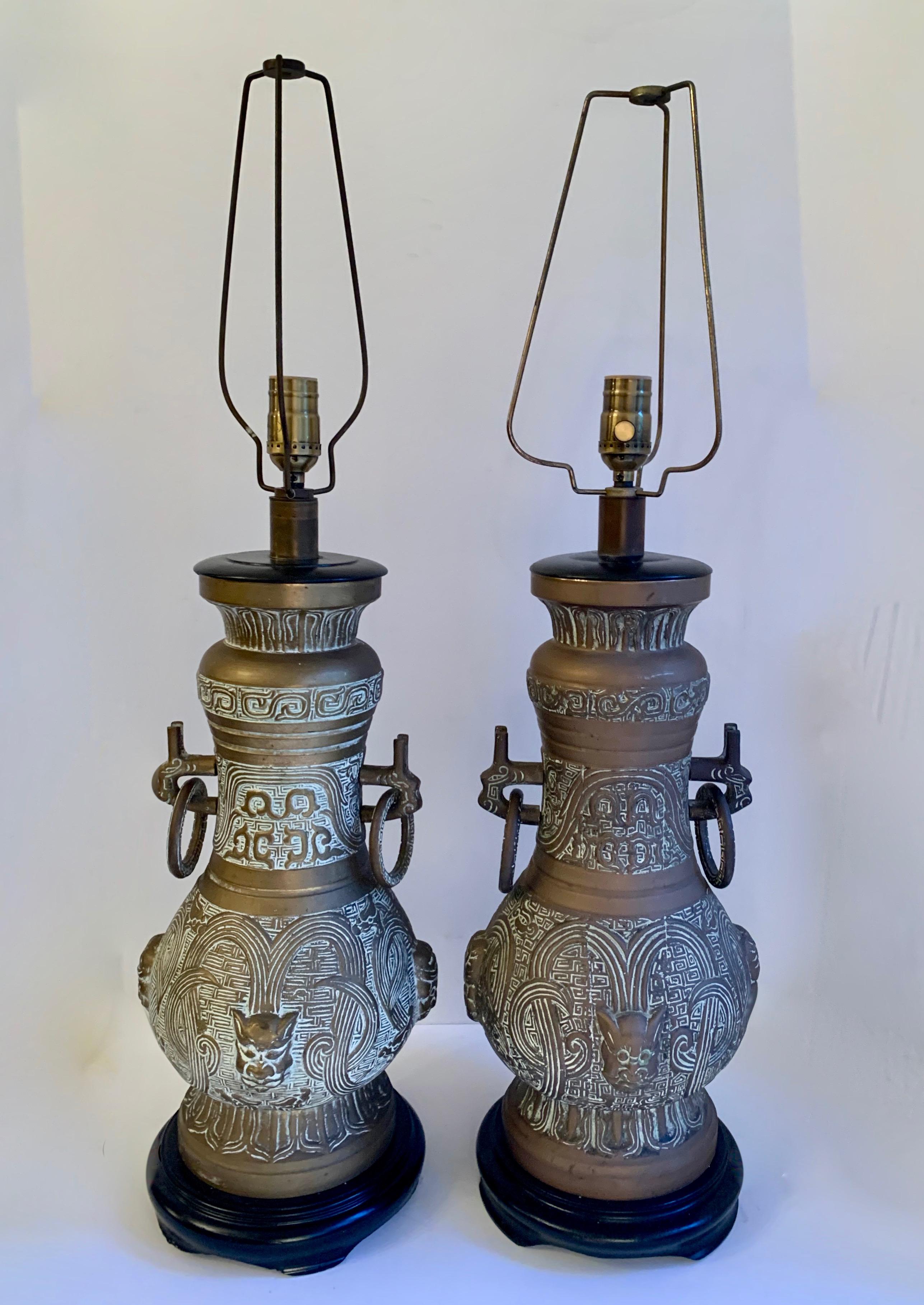 Mid-Century Modern Pair of James Mont Style Bronze Urn Lamps For Sale