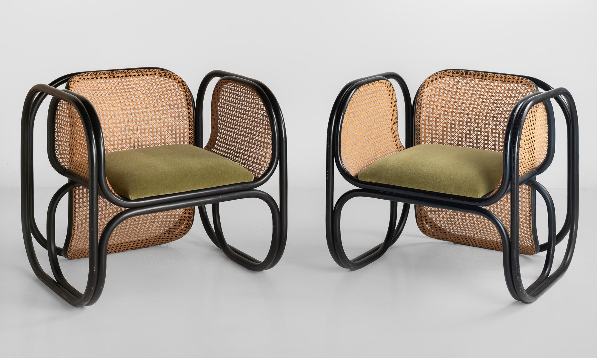 Pair of Jan Bocan armchairs, Czech Republic, circa 1970.

Produced by Thonet, designed for the Czech Embassy of Stockholm. One pair of the 60 armchairs produced. Ebonized bentwood frame with cane webbing on back and sides. Seat is upholstered in