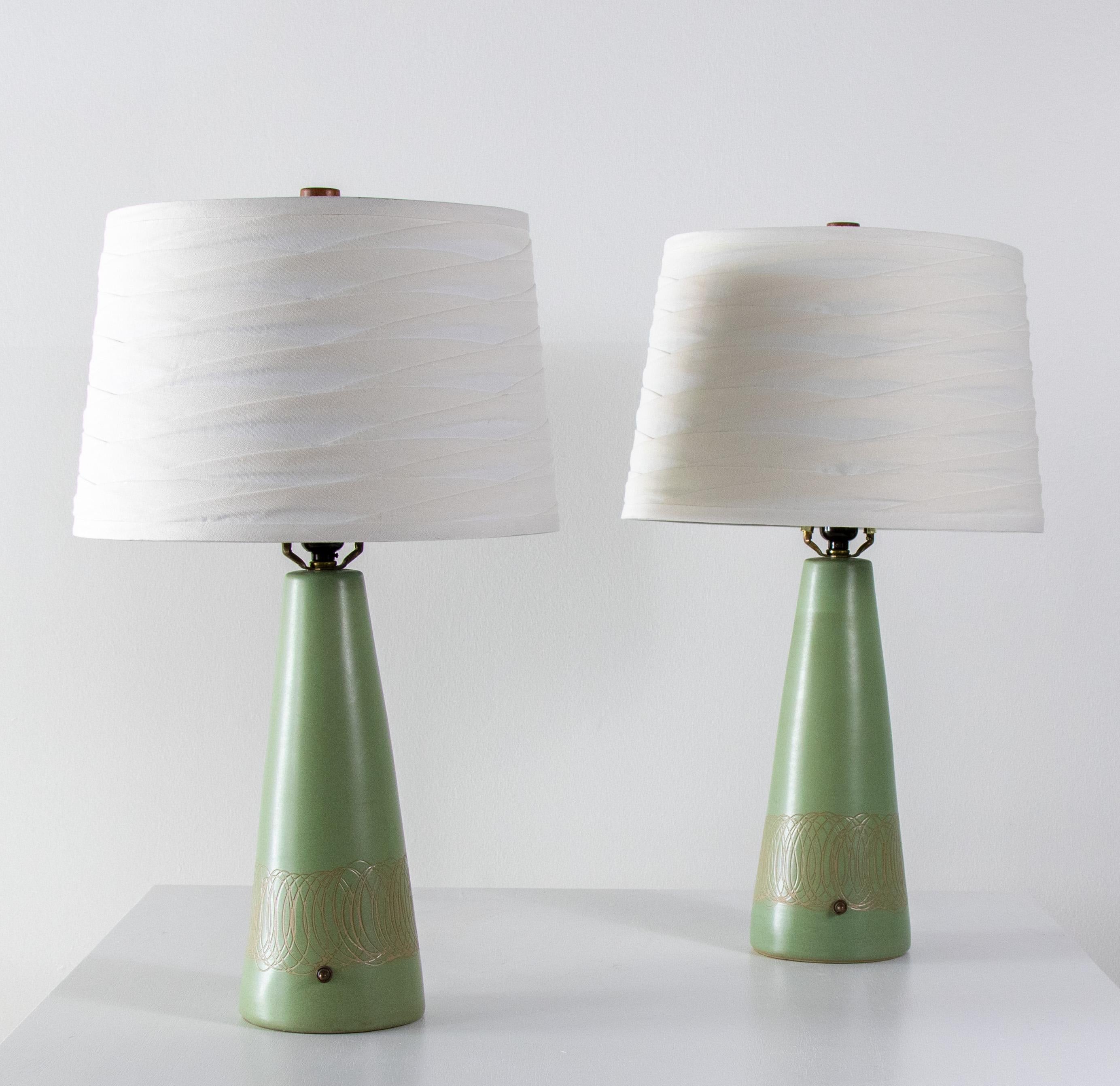 A pair of seafoam green lamps designed by Jane and Gordon Martz of Marshall Studios in Veedersburg Indiana. These lamps are highly sought after and are showing up in designs all over the world. Blending sophistication and modern these lamps are sure