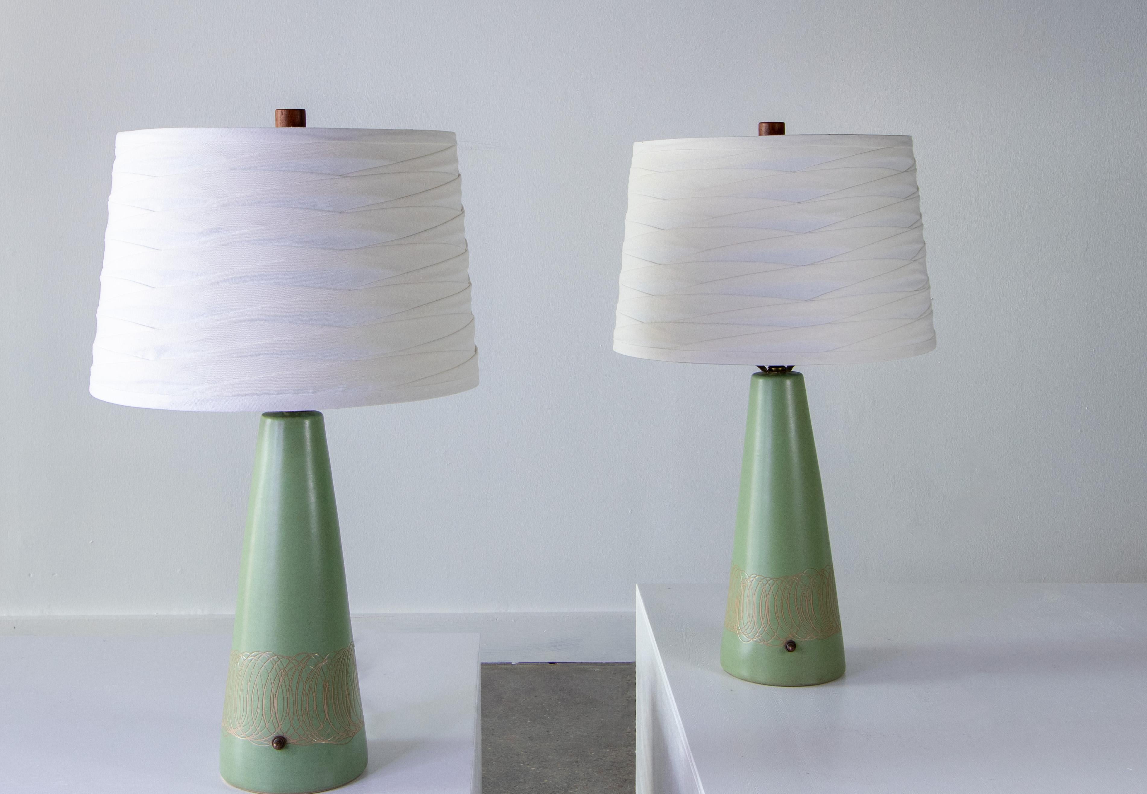 A pair of seafoam green lamps designed by Jane and Gordon Martz of Marshall Studios in Veedersburg Indiana. These lamps are highly sought after and are showing up in designs all over the world. Blending sophistication and modern these lamps are sure
