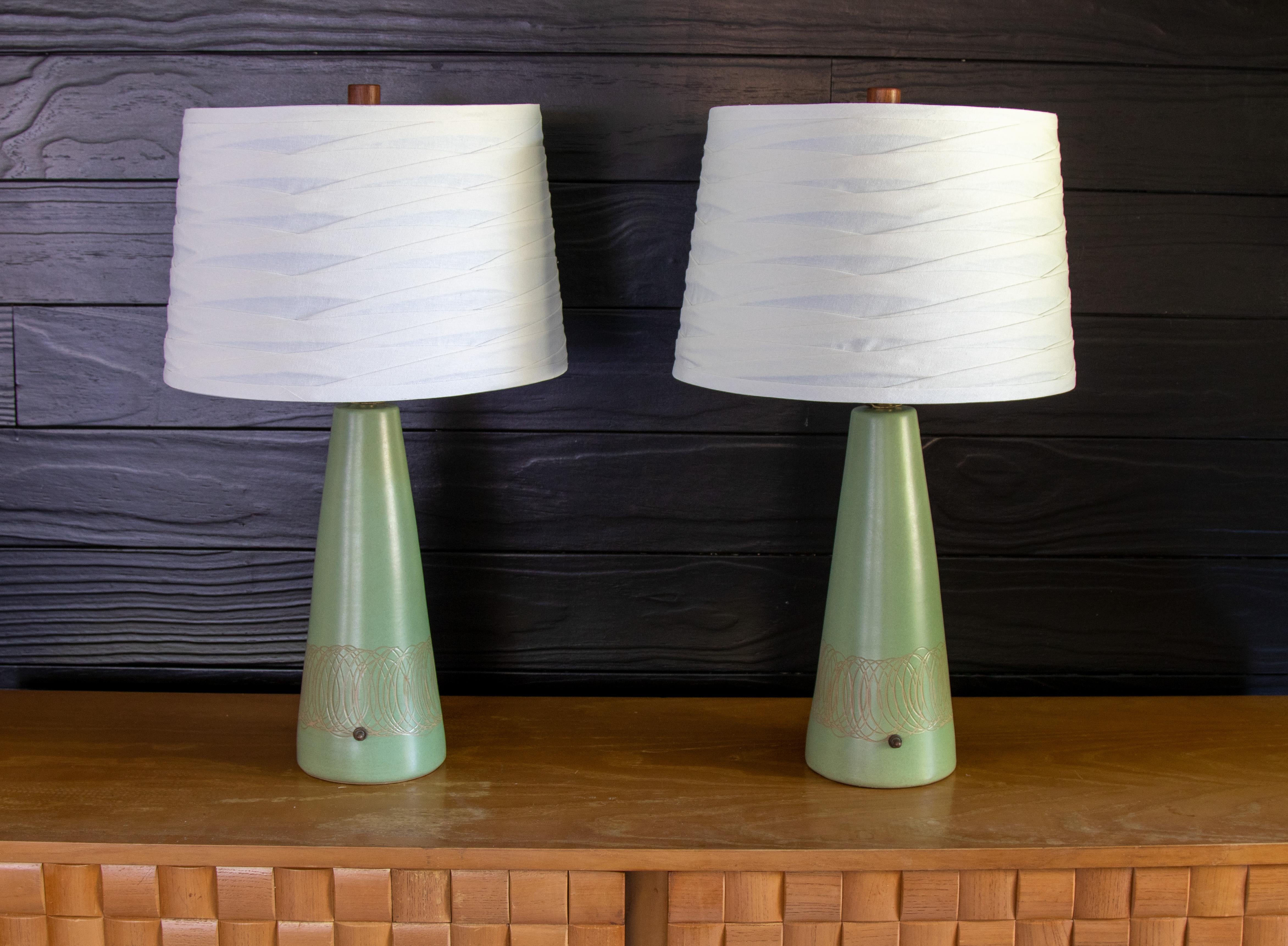 Brass Pair of Jane and Gordon Martz Lamps in Seafoam Green with tan incising