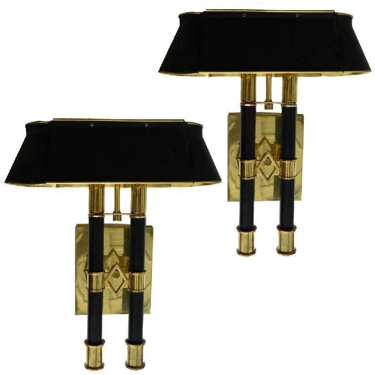 Exceptional pair of Maison Jansen Bouillotte sconces, polished brass and black paint, two lights, 75 watts max each. US wired and working condition. Original patina. Back plate: 6 inches x  H 5.3/4 inches W.
Custom Junction Box is available, please