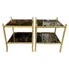Paire de tables d'appoint en laiton et verre églomisé de style Jansen