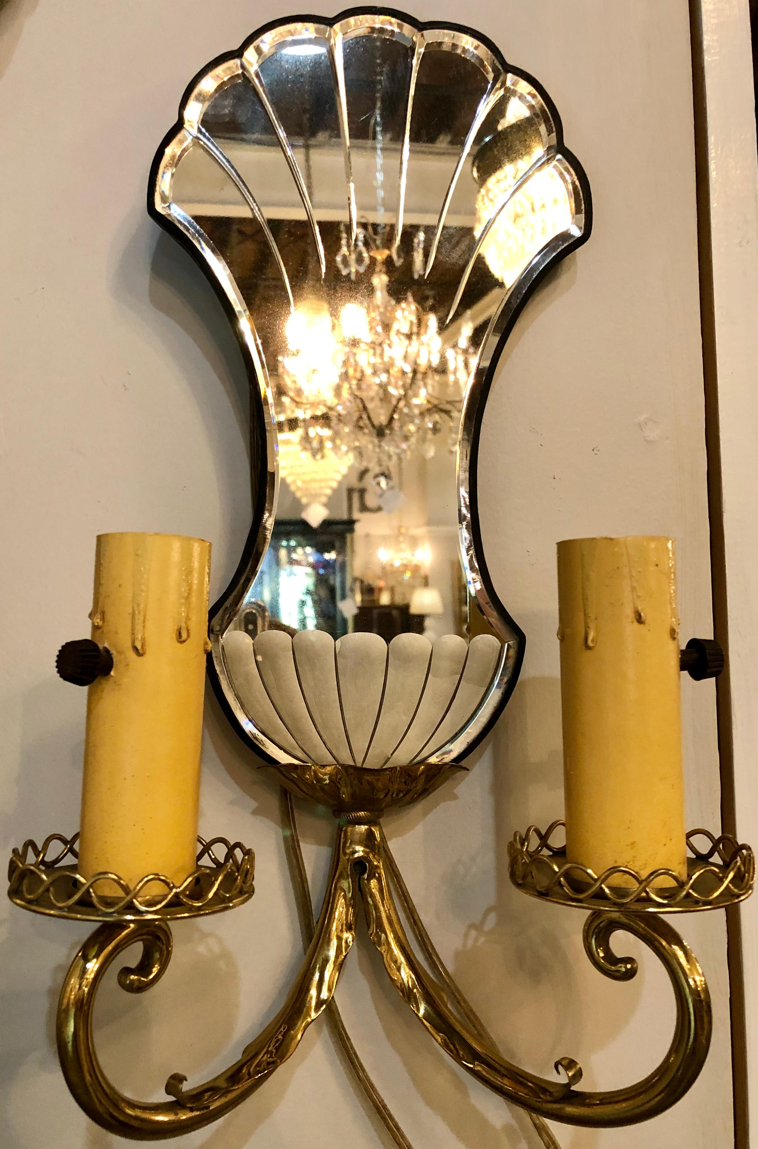 Pair of Jansen wall sconces. Hollywood Regency era with mirror backs each having two arms and etched mirror back plates.