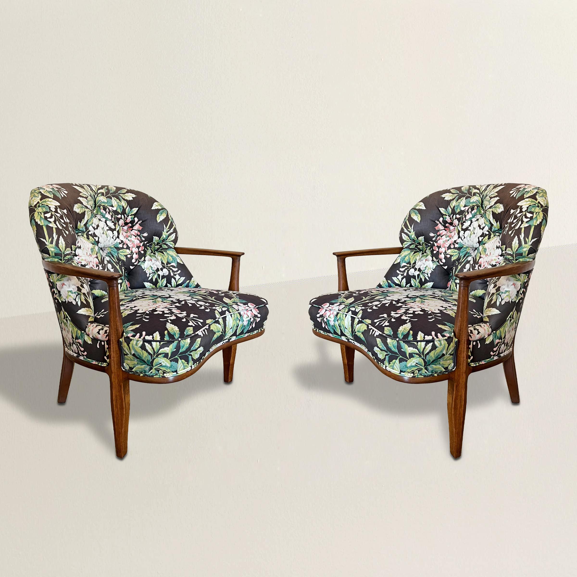 A chic and playful pair of mid-20th century Janus lounge chairs designed by Edward Wormley for American furniture manufacturer Dunbar, with walnut frames and their original floral chintz upholstery.