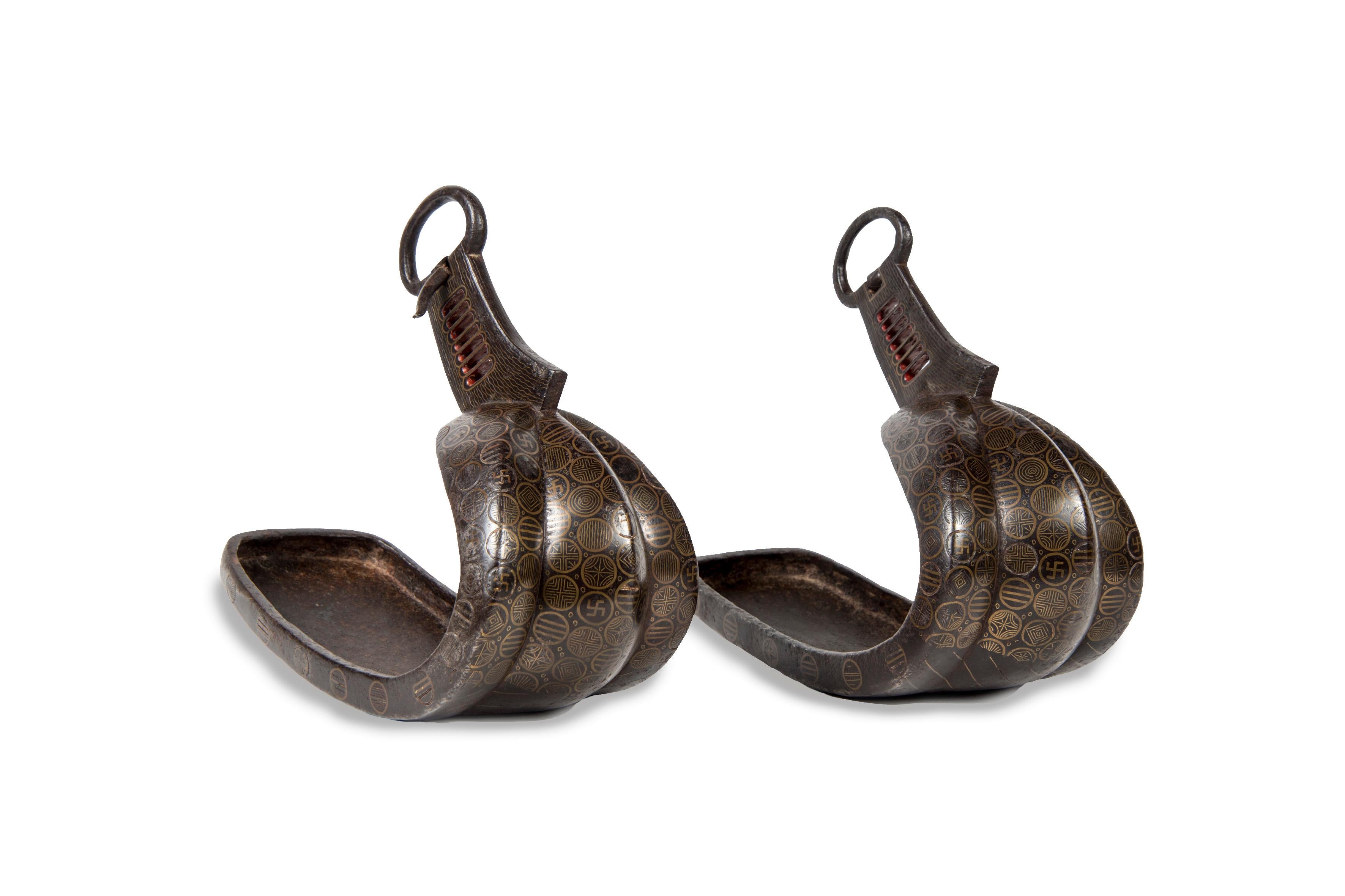Pair of stamped brass stirrups decorated with Hashizuka, Ito and Manabe Mons. 

Japan - Edo (1615-1868), 18th century. 
Height: 10.24 in. (26 cm), length: 12.6 in. (32 cm), width 4.72 in. (12 cm)

 As in Western culture, the culture Japanese