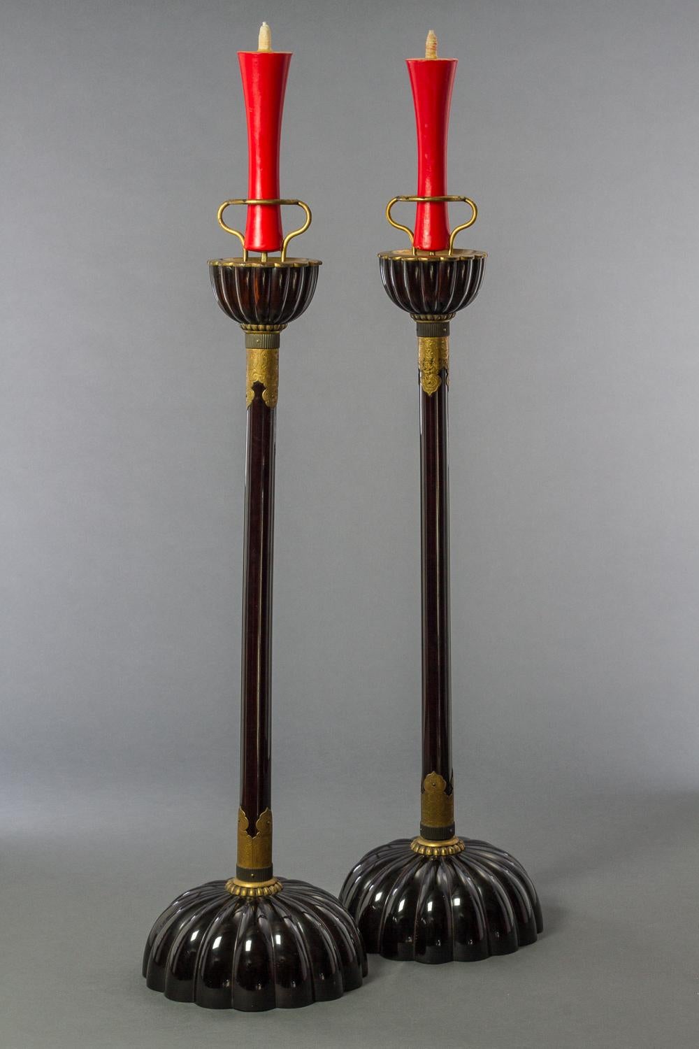 Pair of Japanese black lacquer candlesticks, Kiku, or chrysanthemum, shape bases and sconces with gilt bronze mounts and capitals. (Does not come with candles.)