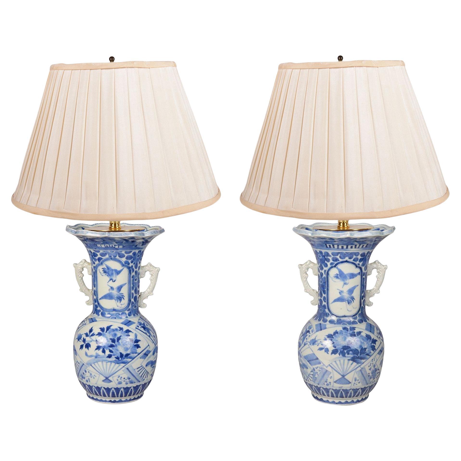 Pair of Japanese Blue and White twin handle lamps / vases, circa 1900