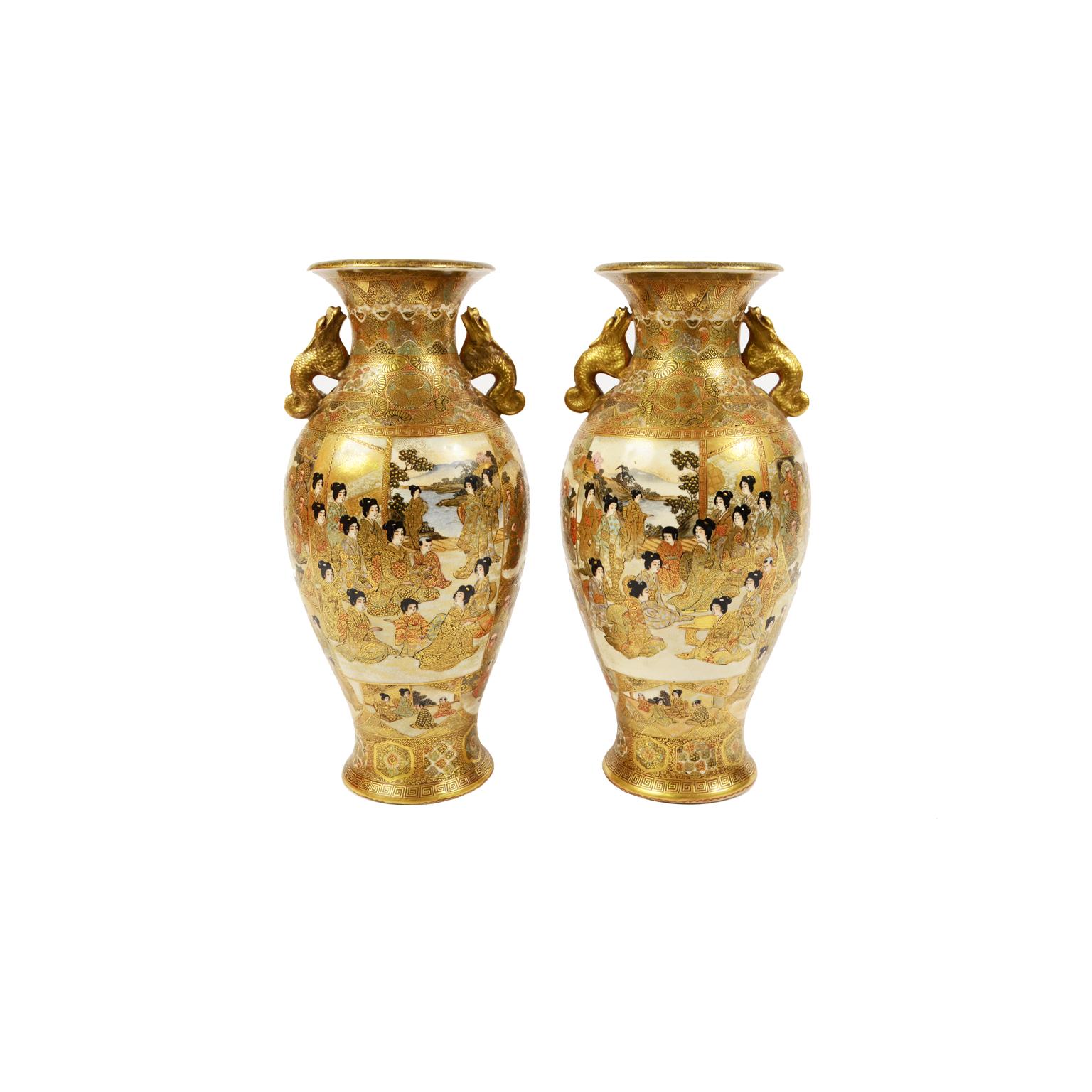 Pair of Satsuma vases made of finely hand-decorated ceramic depicting scenes with geishas and scenes with monks, dragon-shaped handles. Japan, last quarter of the 19th century. On the base signature of the manufacture or artist. Good condition.