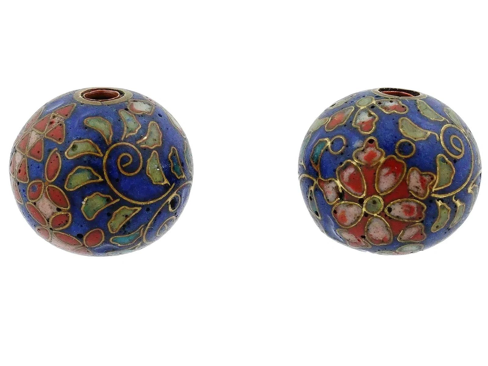 A pair of Japanese enamel Ojime beads. The circular shaped beads are adorned with polychrome floral, foliage and geometrical patterns made in the Cloisonne technique. Antique and Vintage Asian Beads and Accessories For Collectors.
Dimensions: 1/2 x
