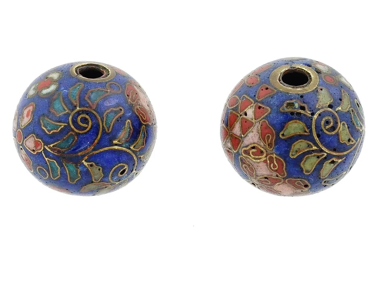 A pair of Japanese enamel Ojime beads. The circular shaped beads are adorned with polychrome floral, foliage and geometrical patterns made in the Cloisonne technique. Antique and Vintage Asian Beads and Accessories For Collectors.
Dimensions: 1/2 x
