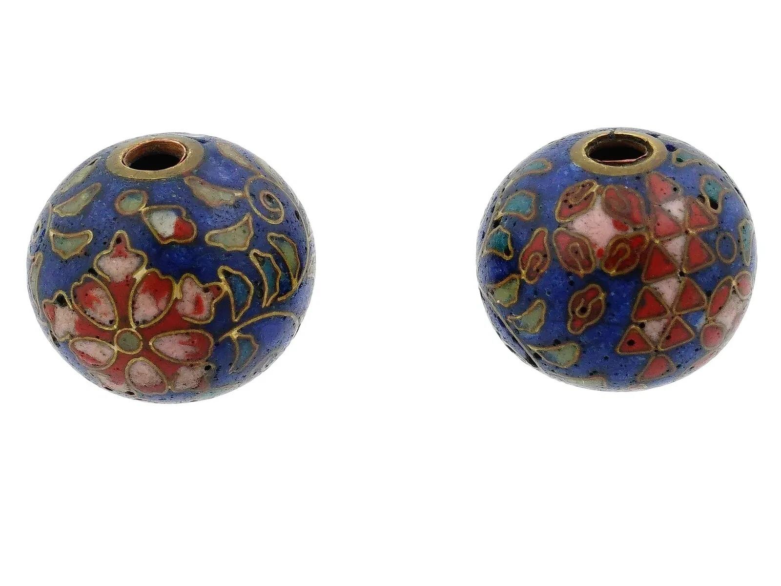 A pair of Japanese enamel Ojime beads. The circular shaped beads are adorned with polychrome floral, foliage and geometrical patterns made in the Cloisonne technique. Antique and Vintage Asian Beads and Accessories For Collectors.
Dimensions: 1/2 x