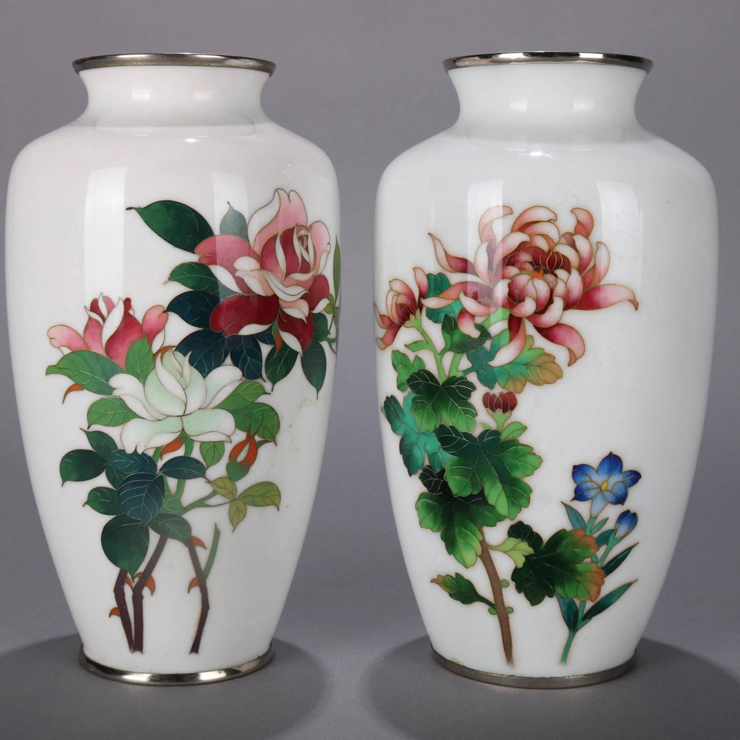 Pair of Japanese cabinet vases feature floral design with cloisonné enameled roses and chrysanthemum in white ground, marked on base 