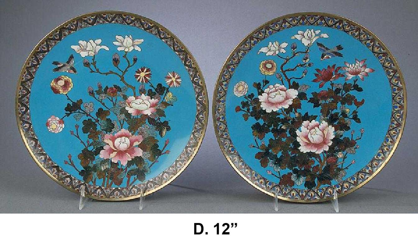 Lovely opposing pair of Japanese cloisonné enamel chargers, Meiji Period (1868-1912)

Intricate enamel over brass cloisonne portraying a colorful floral and foliage motif with flying birds enclosed in a geometrical patterned border. The backside