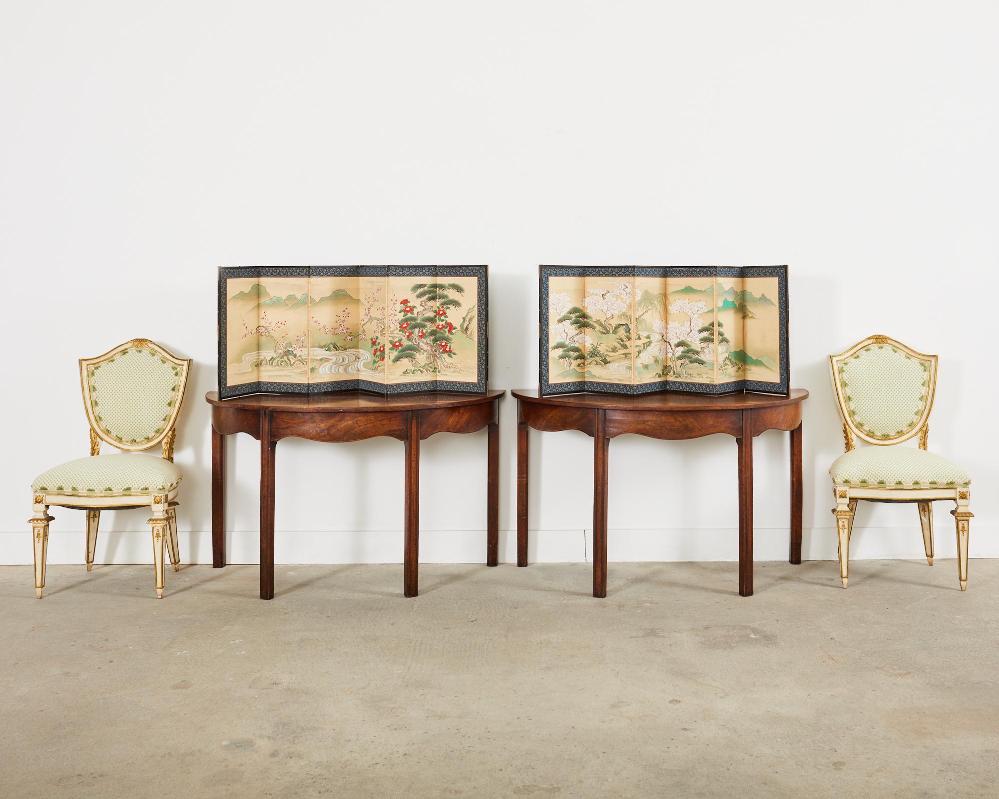 Colorful pair of 19th century Japanese Edo period six-panel byobu table screens depicting pairs of Minogame turtles in spring landscapes. Made in the Kano school style one screen features pines, willow, and flowering cherry trees. The other screen