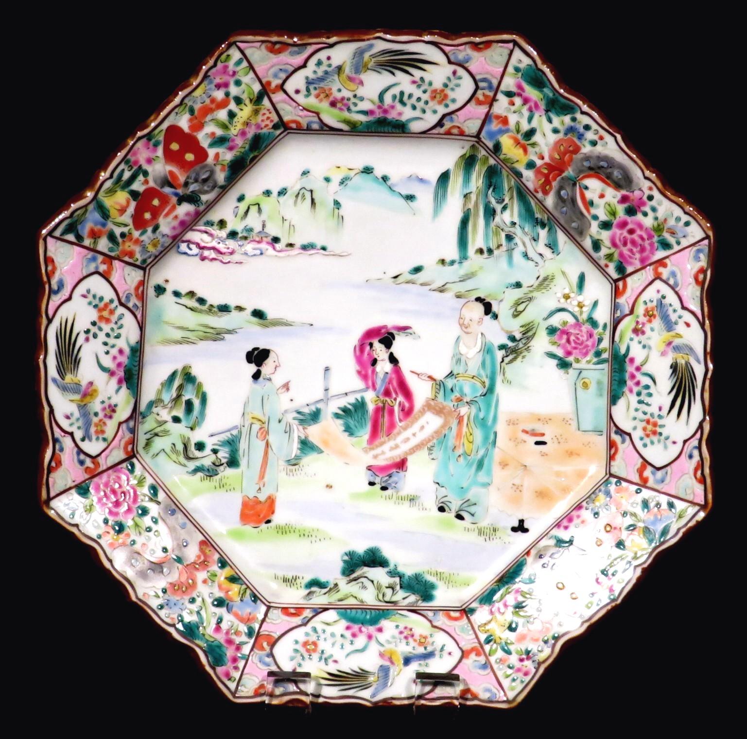 These fine cabinet plates date from the Meiji Period (1868-1912), showing richly decorated hand painted enamelled bodies. Their central fields illustrating finely executed vignettes depicting figures in garden landscapes within a panelled border of
