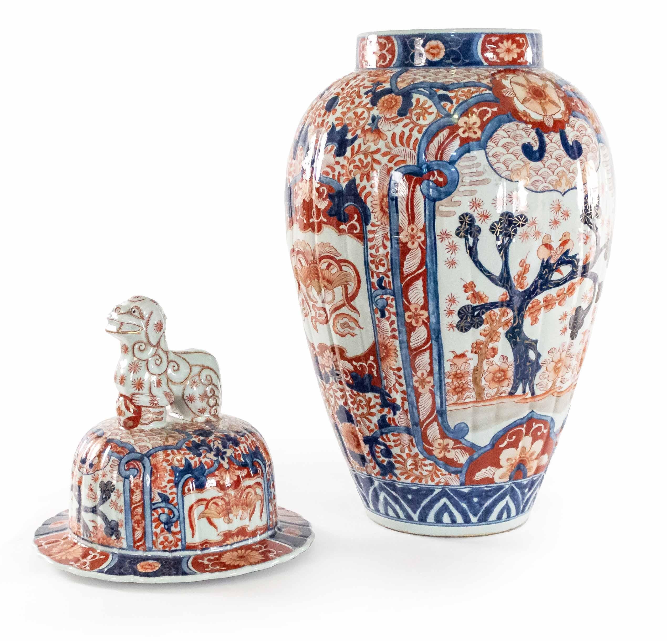 Pair of Asian Japanese large imari rose porcelain covered baluster-shaped vases (temple jars) with lids having foo dog finials (19/20th Century).
 