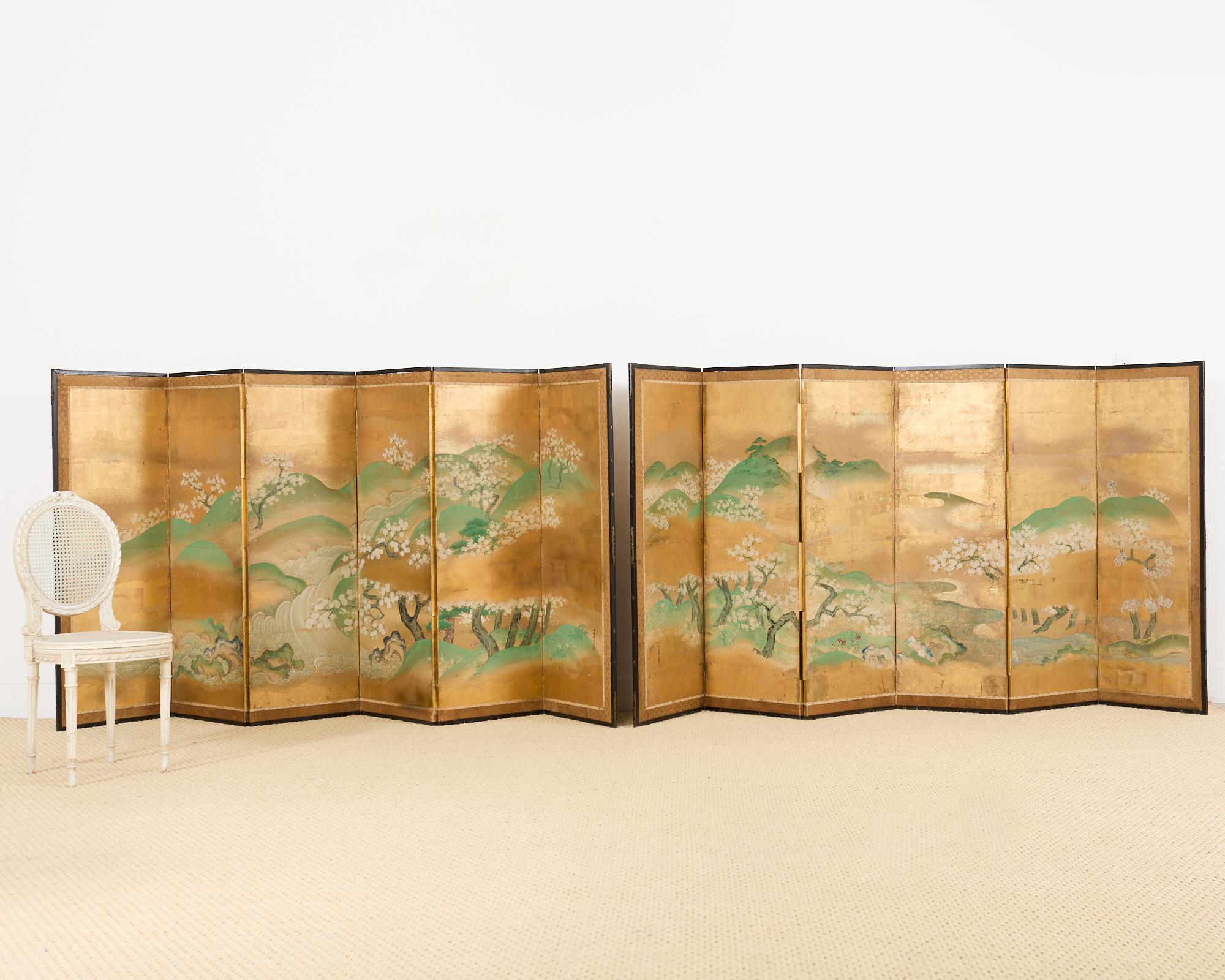 Important pair of Japanese late 18th century Edo period byobu six-panel screens painted by Tsuruzawa Tansaku (Japanese 1729-1797). The screens depict flowering cherry Sakura trees blossoming on Yoshino mountain. The dramatic landscape is painted in