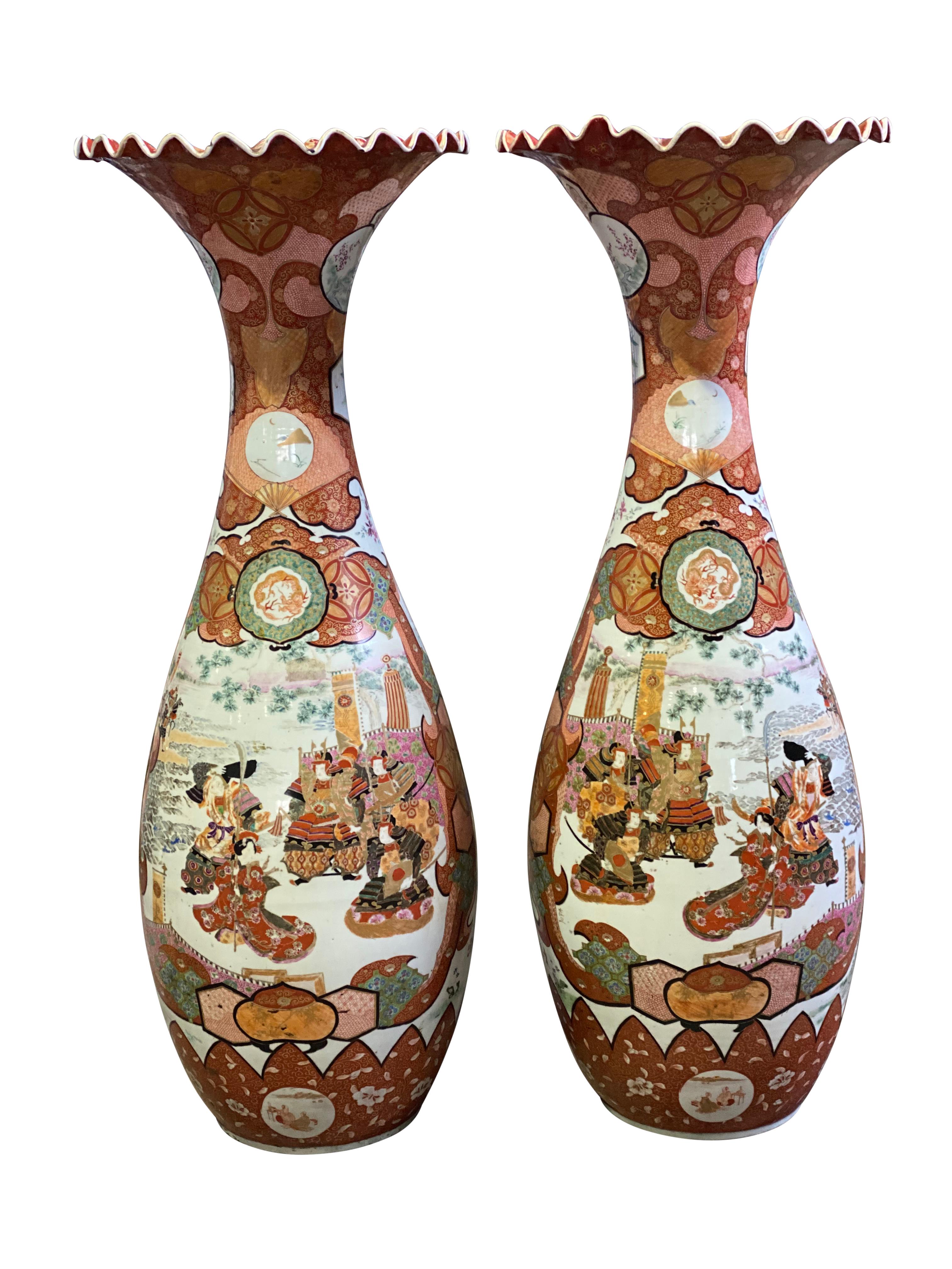 A pair of delightful 19th century antique vases, with globular body opening into ruffled rim with various flower heads inside the rim. The smooth bodies decorated in a traditional manner with blue, red, green and pink motifs, highlighted with floral