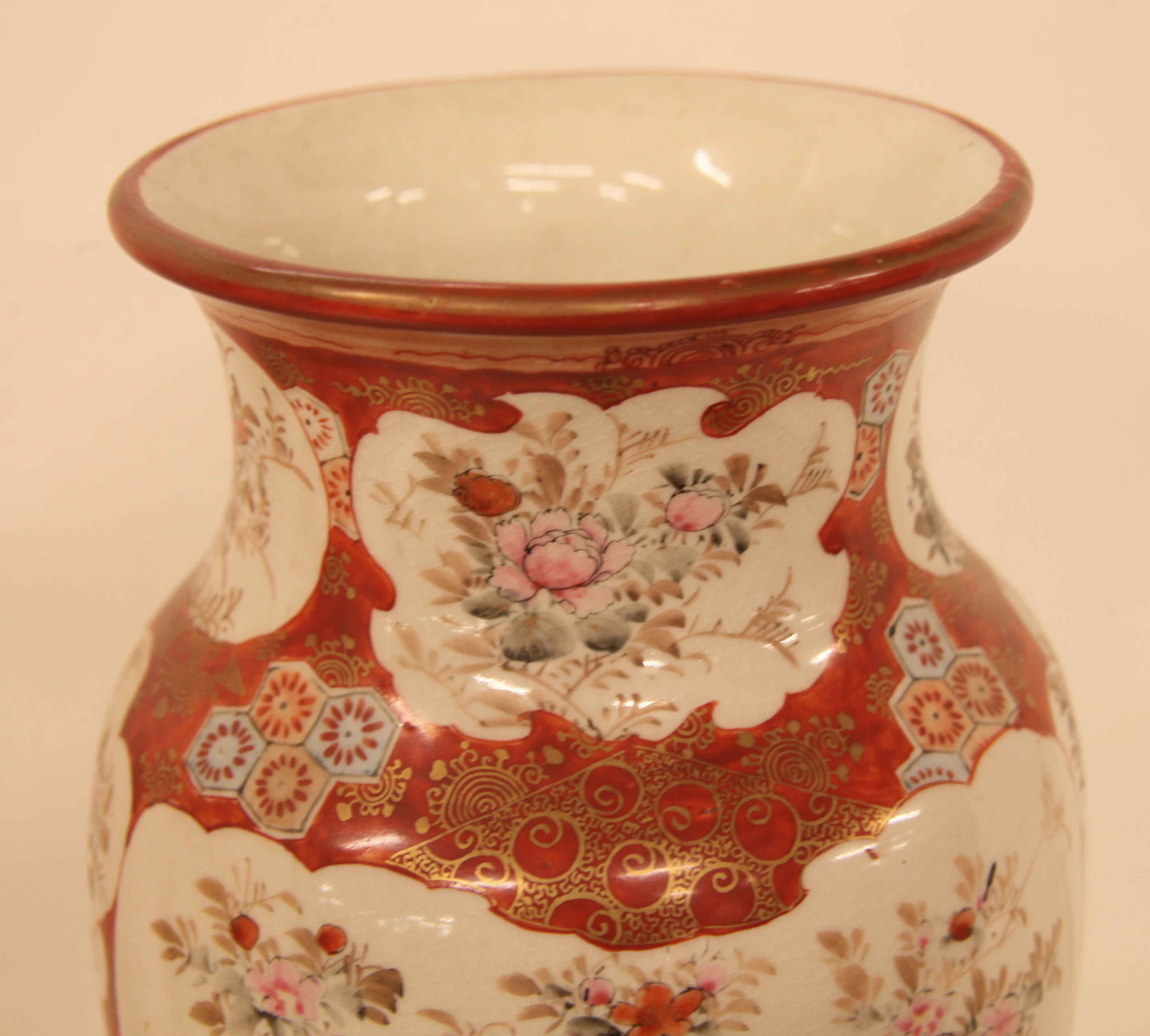 Pair of Japanese Kutani vases, the rim is decorated with a series of floral scenes, below in the main body on each side are panels featuring a single brid surrounded by flowers and foliate; between these are scalloped shaped scenes of flowers and