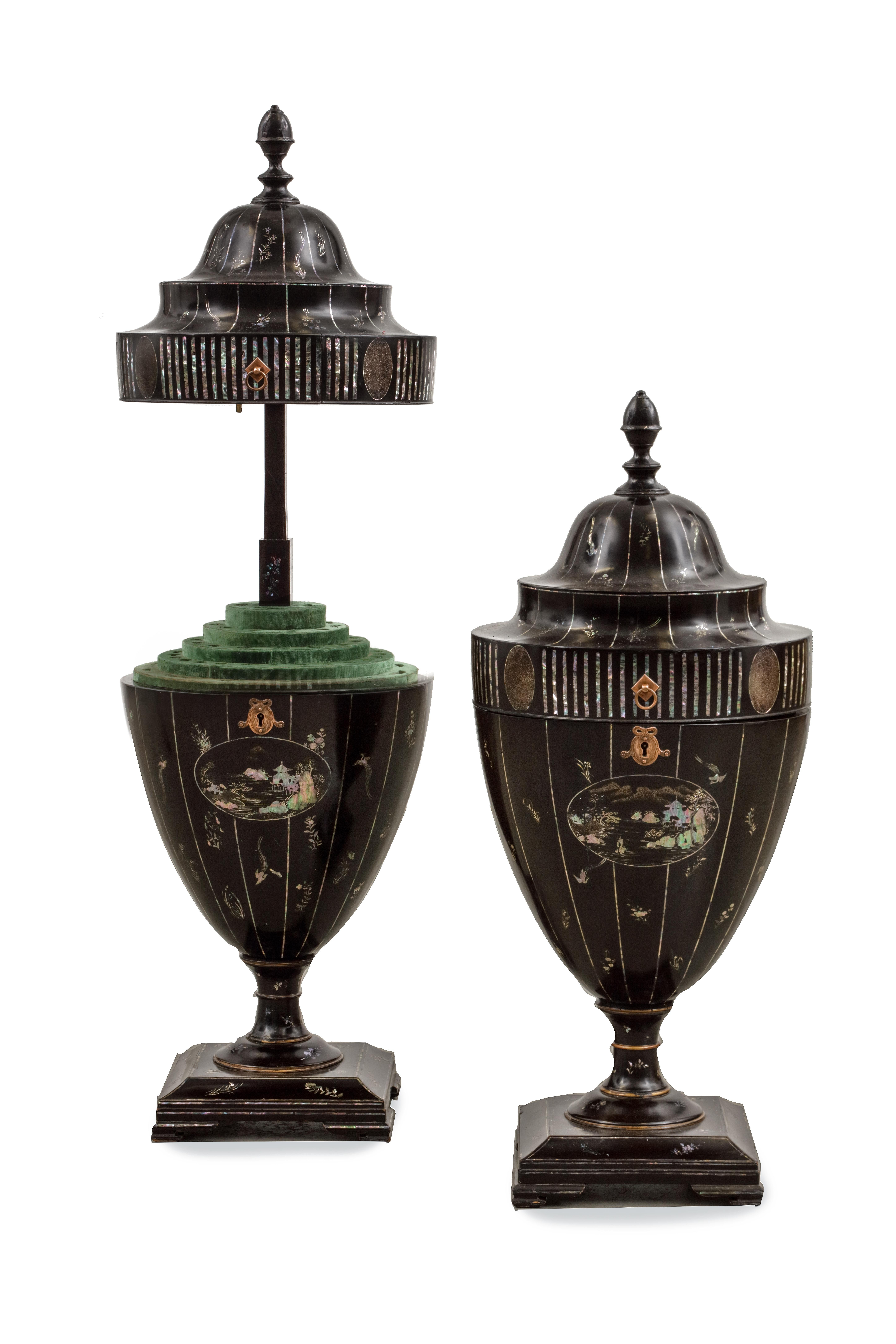 A rare pair of Kyoto-Nagasaki style lacquer and mother-of-pearl inlaid knife urns
Edo period, early 19th century

Measures: Height 71 x diameter 30 cm

?Formed as urns with vertically lifting covers and elongated finials, revealing fitted green