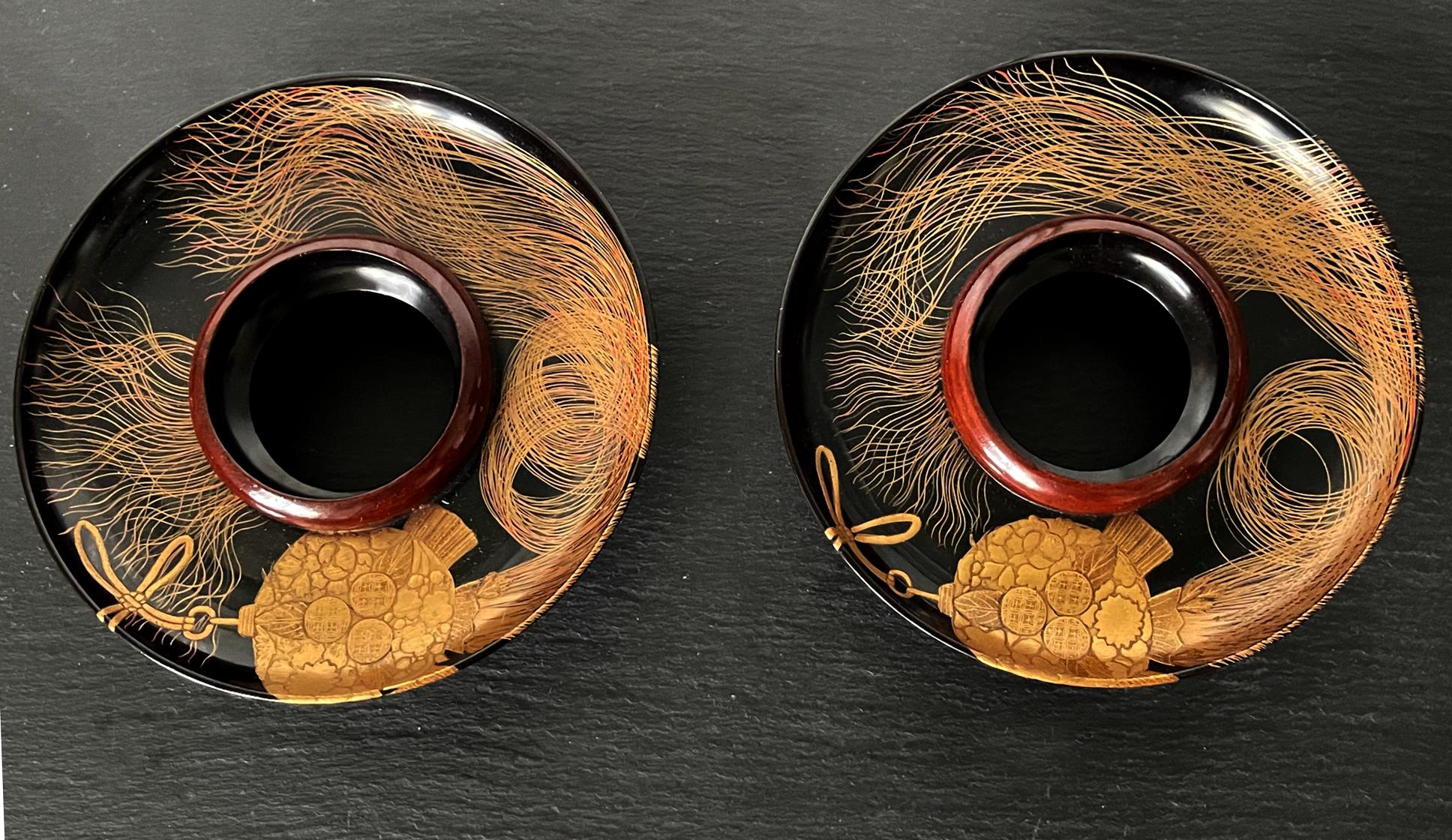 A pair of Japanese lacquered wood cup stands with Maki-e decoration circa end of 19th century of Meiji period. These stands were used to present tea or sake cups at elaborate parties and therefore not for daily use. The surface of these pieces was