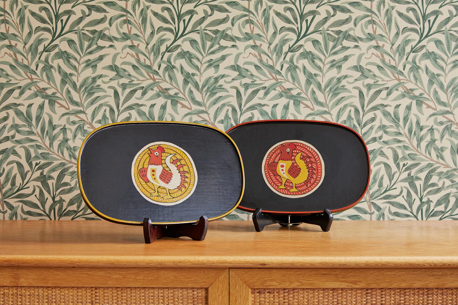Lovely pair of lacquer trays with chicken design.
 
Joji Harada was born in Tokyo in 1949. He exhibited his lacquerware yearly in Okinawa. Okinawa has a long tradition of producing and exporting lacquer.
In addition to making original pieces, he