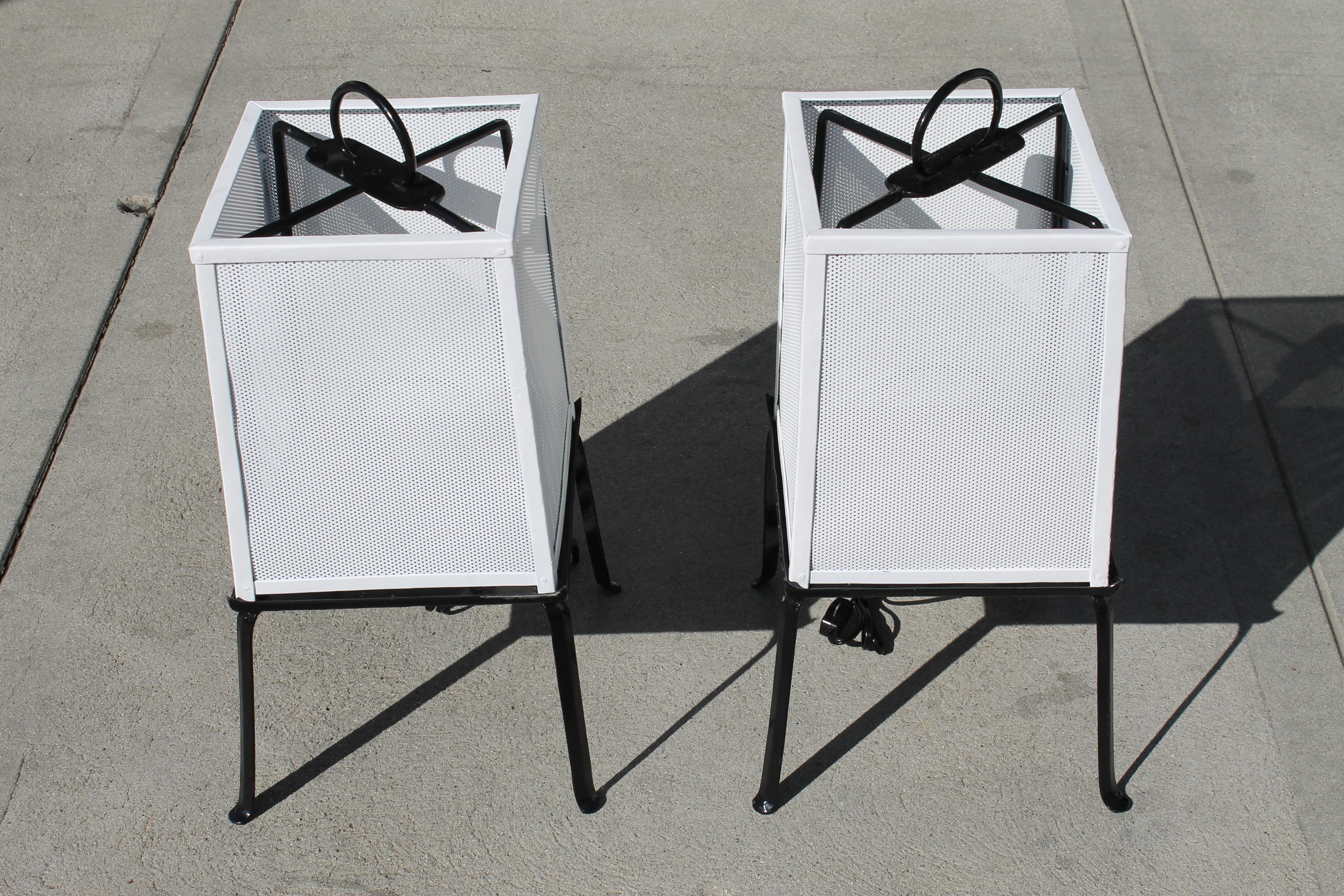 Pair of whimsical Japanese lantern table lamps. We had them sand blasted and powder-coated. The white shades were replaced with perforated steel on the 4 sides. Shades measure: 9