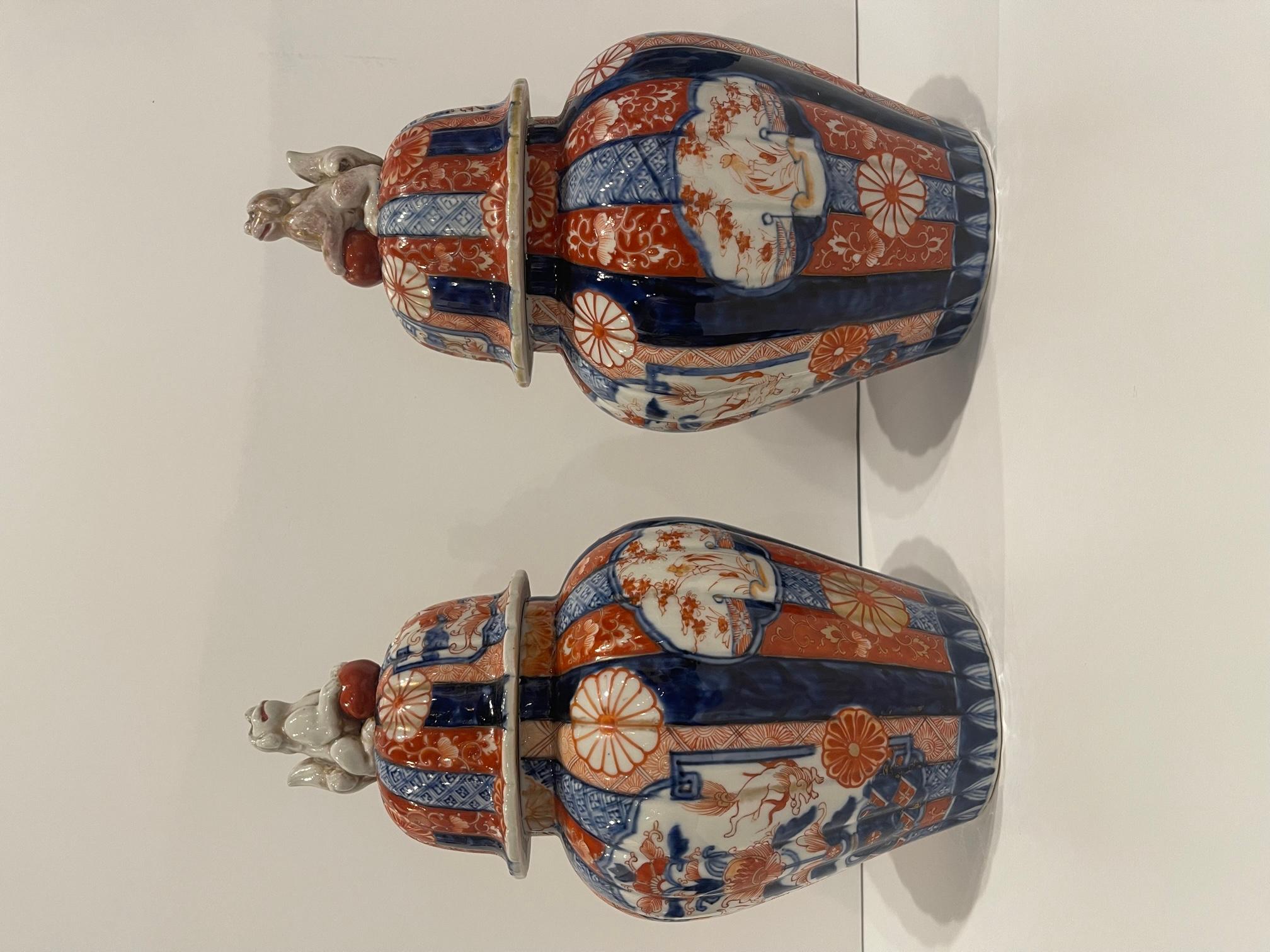 Pair of Japanese Meiji Period Porcelain Lidded Jars, 19th Century .  Wood stands are included