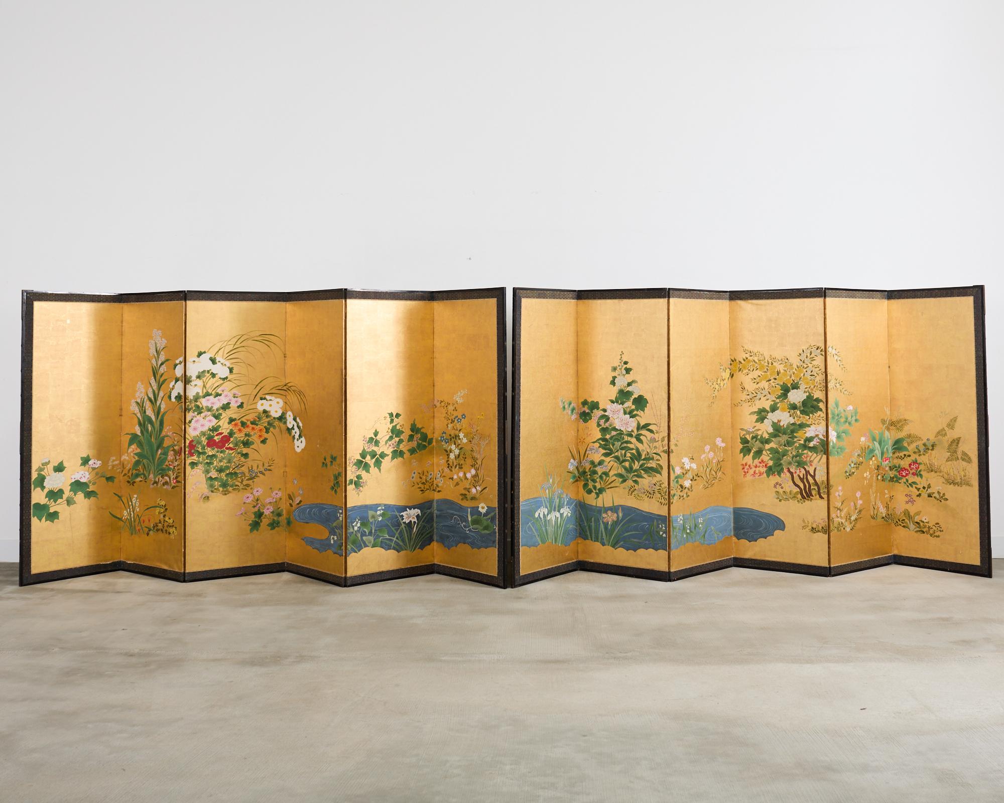 Amazing pair of late 19th/early 20th century Japanese Meiji period byobu screens depicting flowering plants and blossoms of the spring, summer, and autumn. Painted in the Nihonga school style with ink and natural mineral color pigments over a