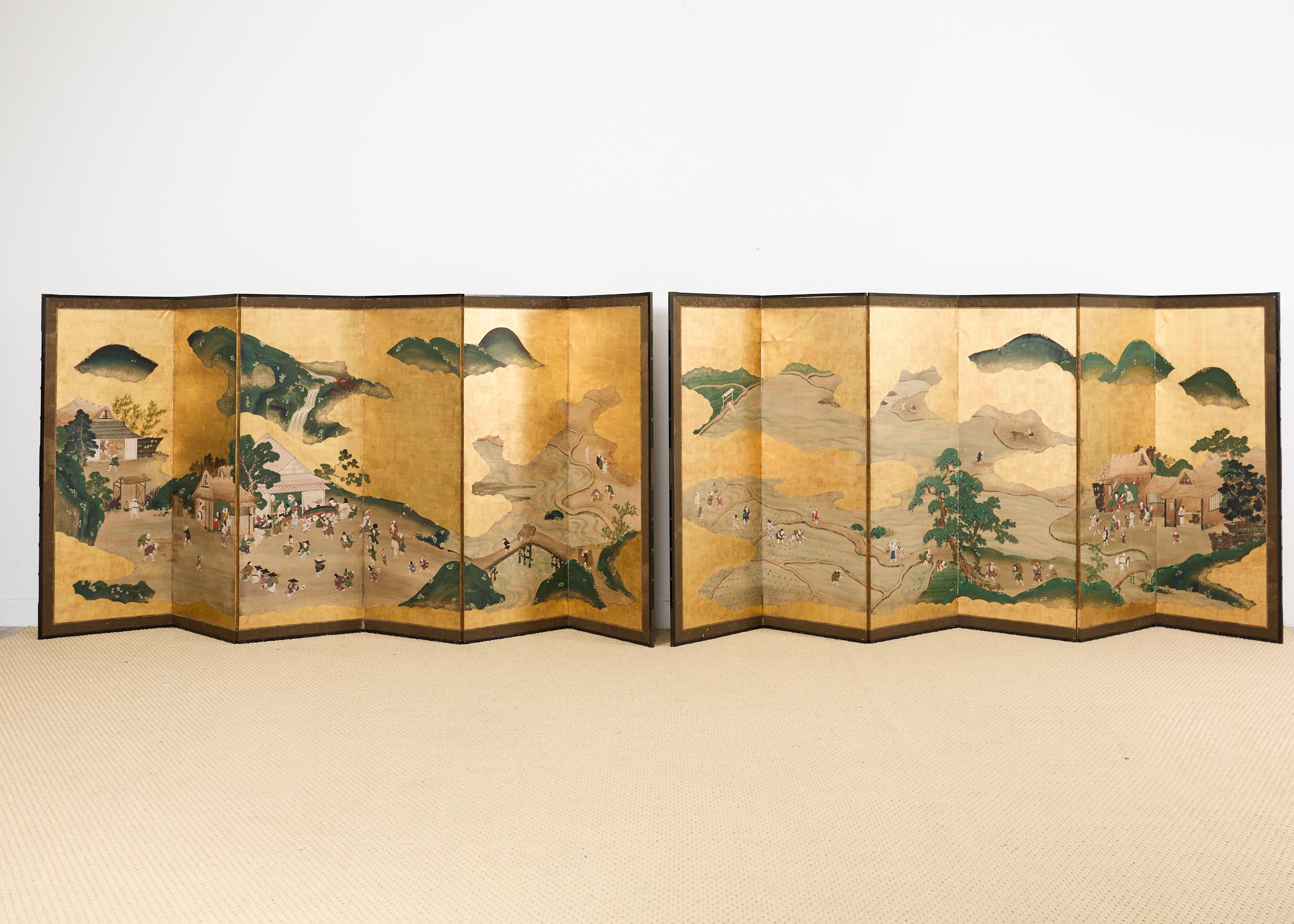 Fascinating pair of large late 19th century Meiji period six-panel screens featuring festival dancers in a village landscape and agricultural activities in a country village. Machi-eshi anonymous town artist or painter made in the Nihonga school