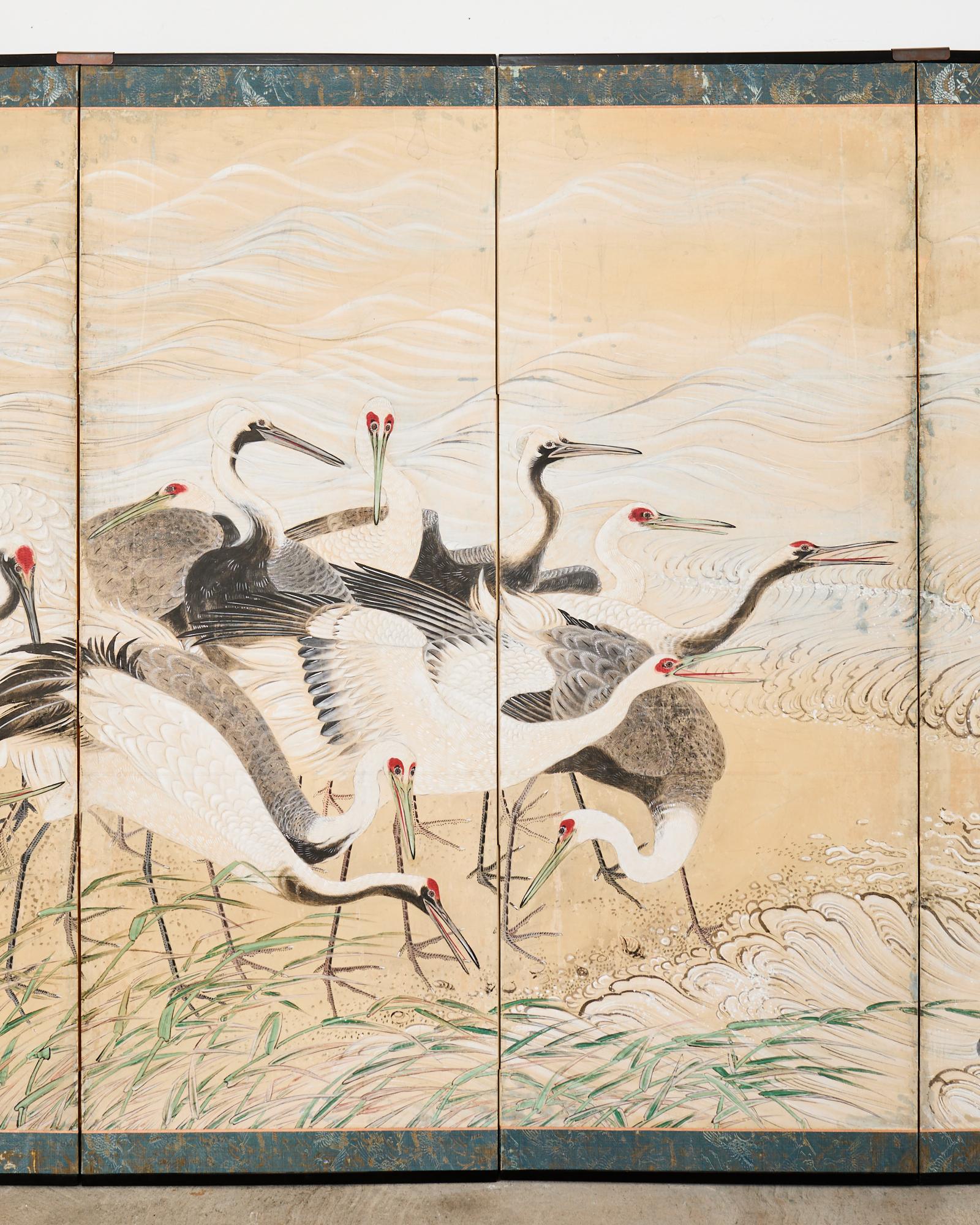 19th Century Pair of Japanese Meiji Six Panel Screen Cranes Above Cresting Waves For Sale