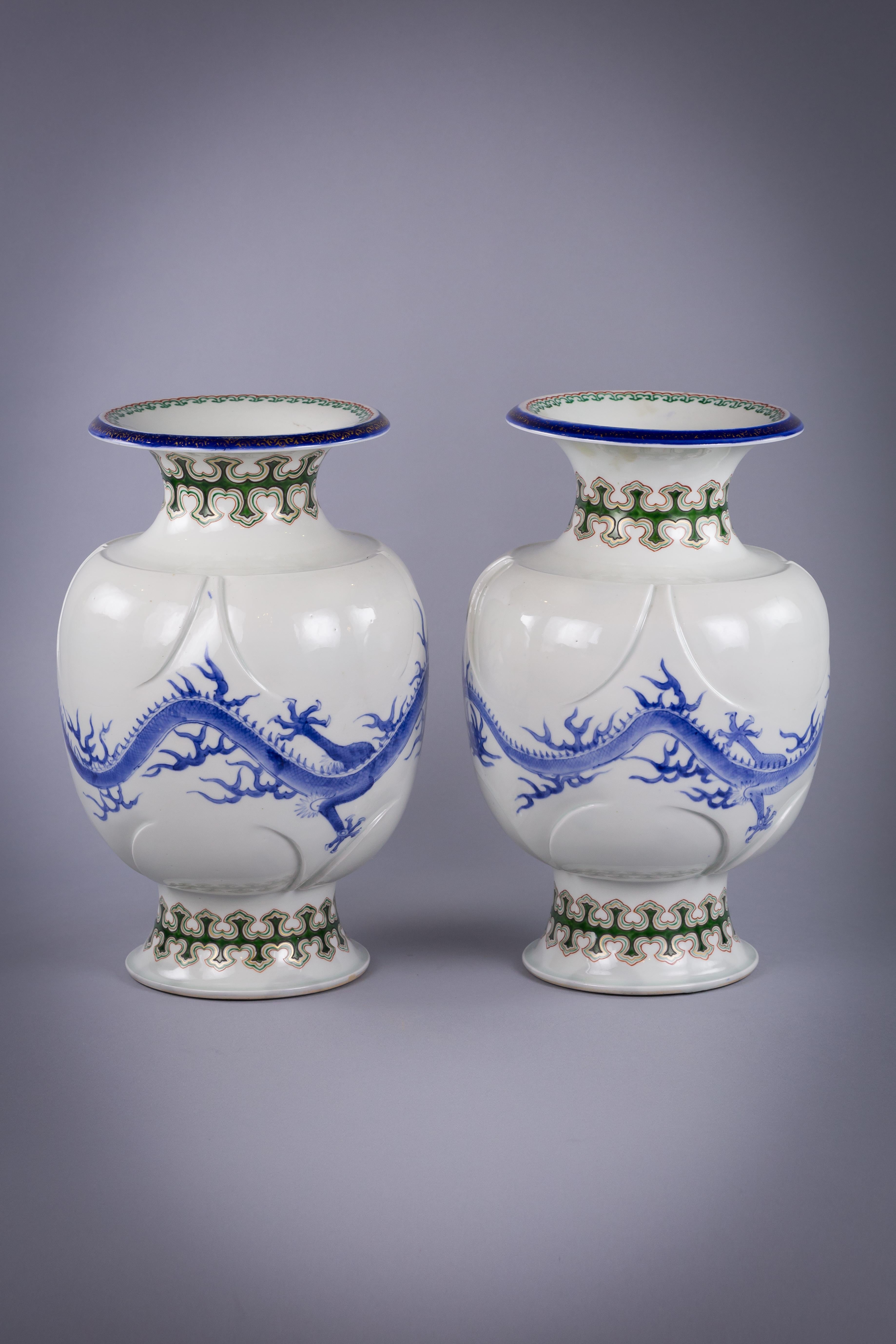 Pair of Japanese porcelain dragon vases, with molded lappets, circa 1880.