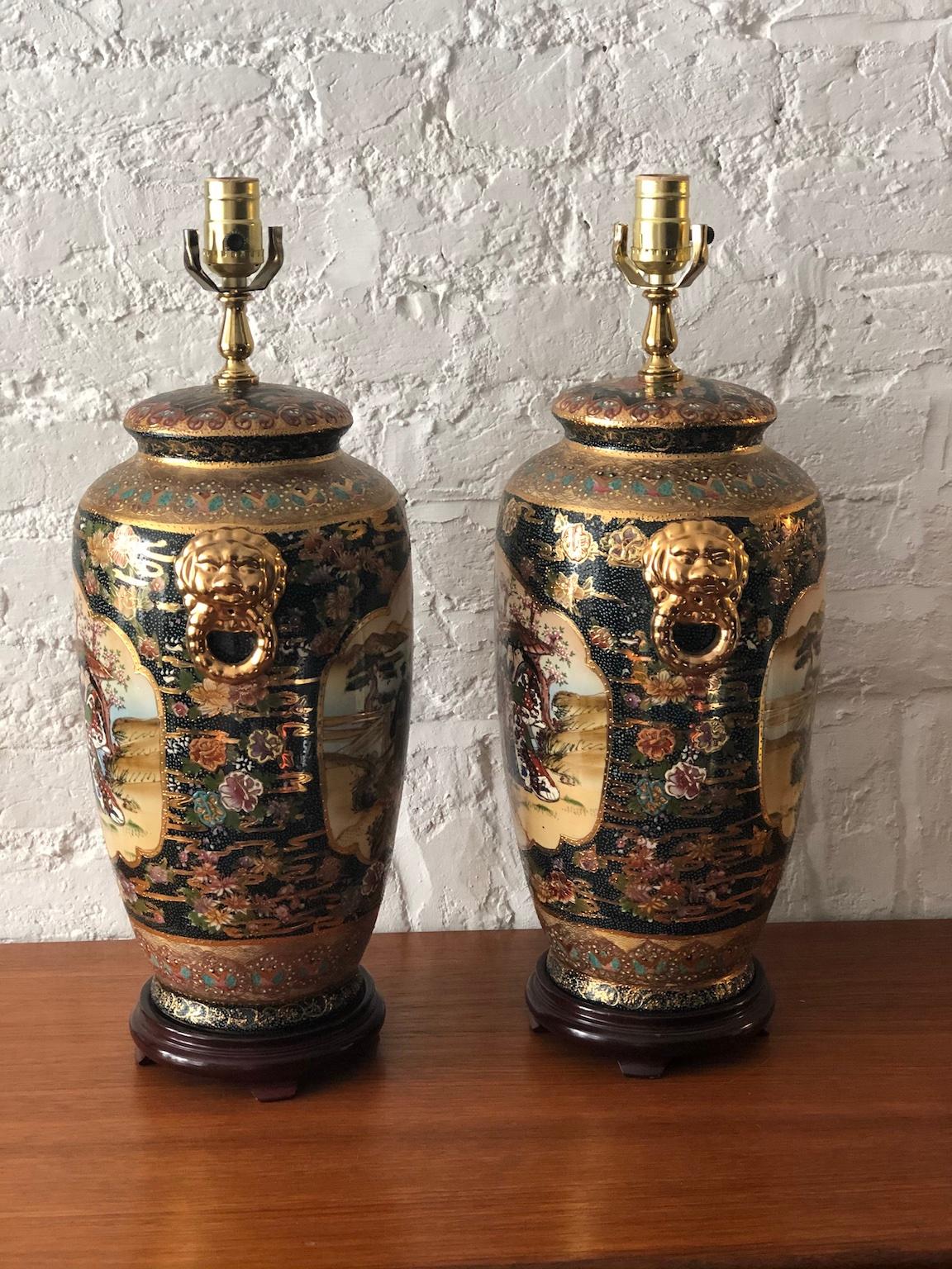 Pair of Japanese Satsuma Moriage double sided hand painted vase lamps

Stunning pair of Japanese Satsuma Moriage hand painted vases, mounted on wooden bases and converted to lamps.
Lion head handles either side. 

Decorated with heavy raised