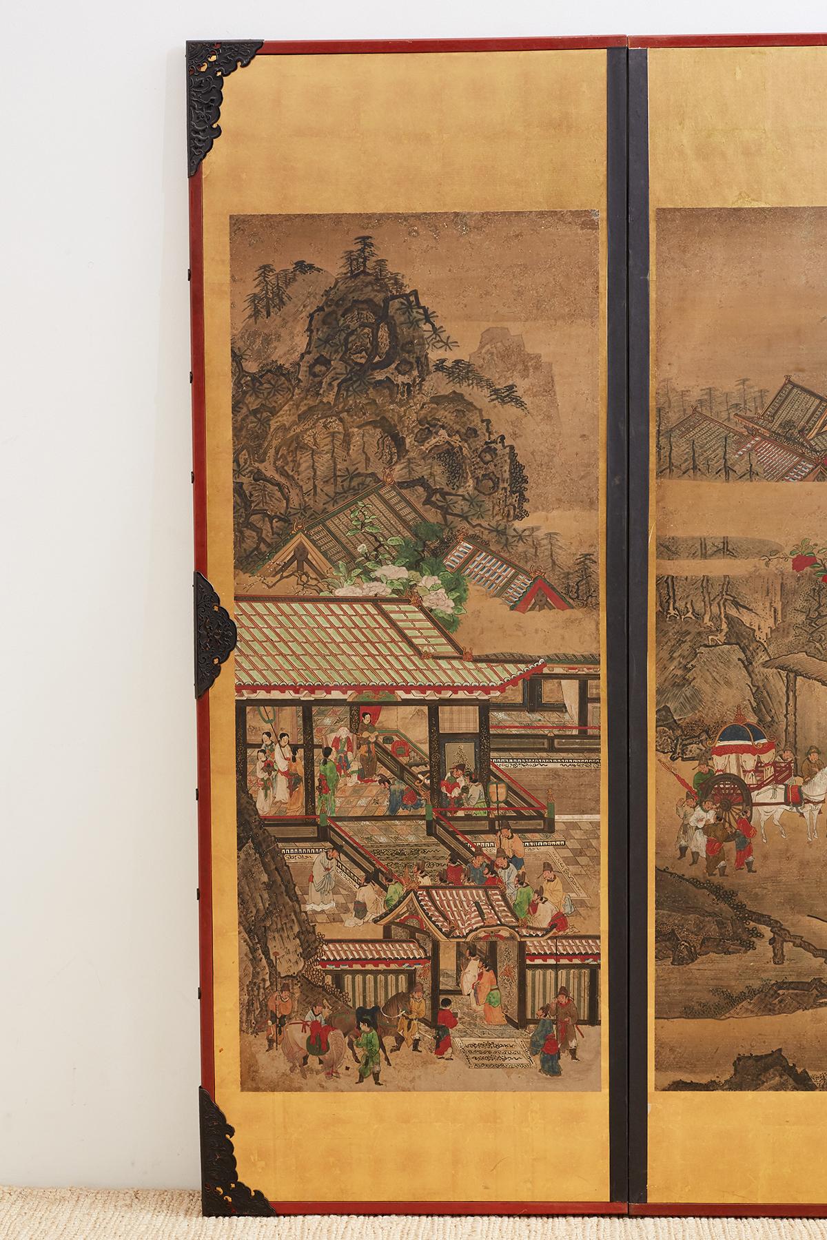 Colorful pair of Japanese scrolls mounted as panels each having a border of gold leaf squares. Set in wooden frames that are painted with ebonized metal decoration. Appear to be parts of larger screens or scrolls painted with Kano School style and