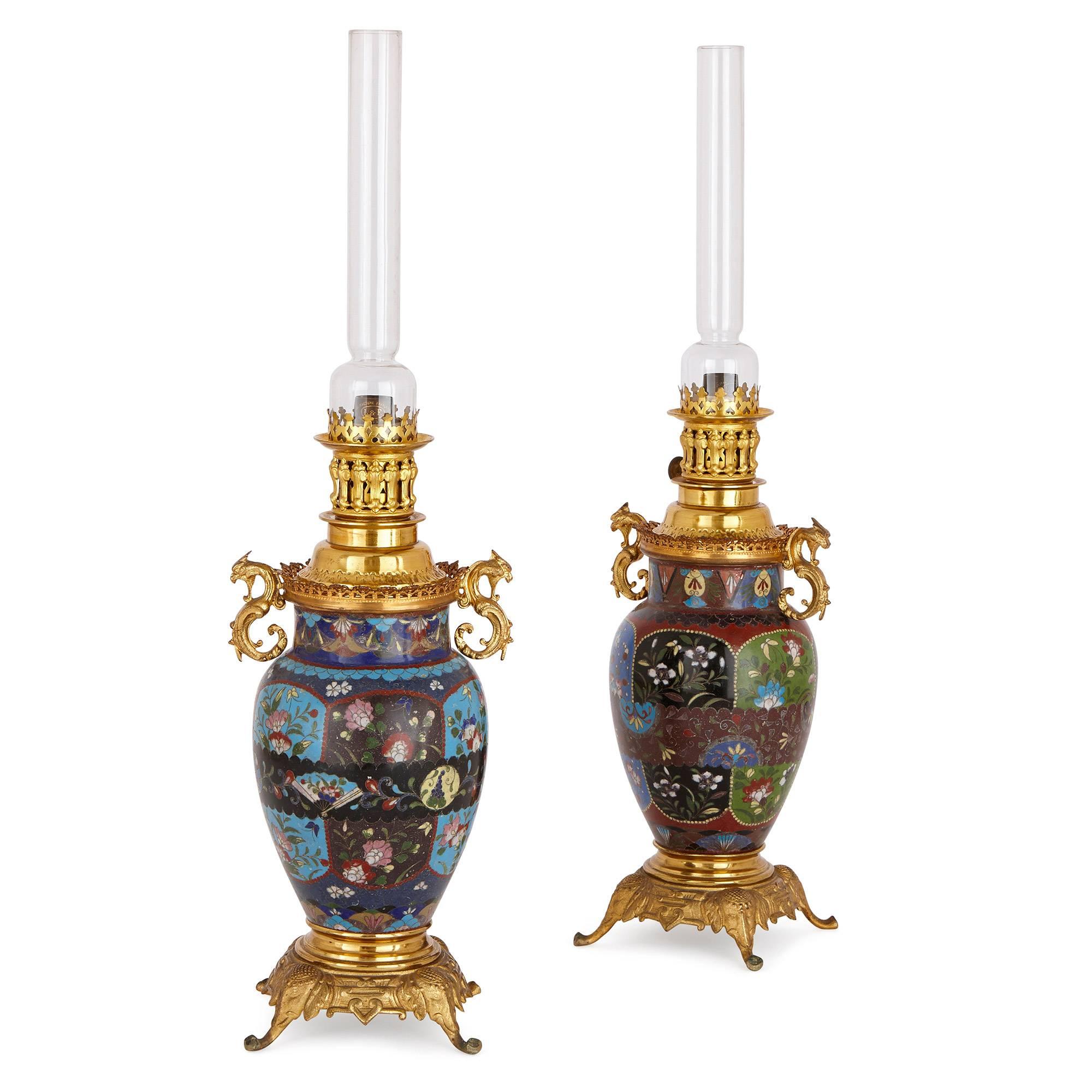 The late 19th and early 20th century craze for Japanese art, known more commonly as Japonism, provides the inspiration for this wonderful pair of lamps. Combining fine Japanese Meiji style cloisonne enamel work with sumptuous French gilt bronze