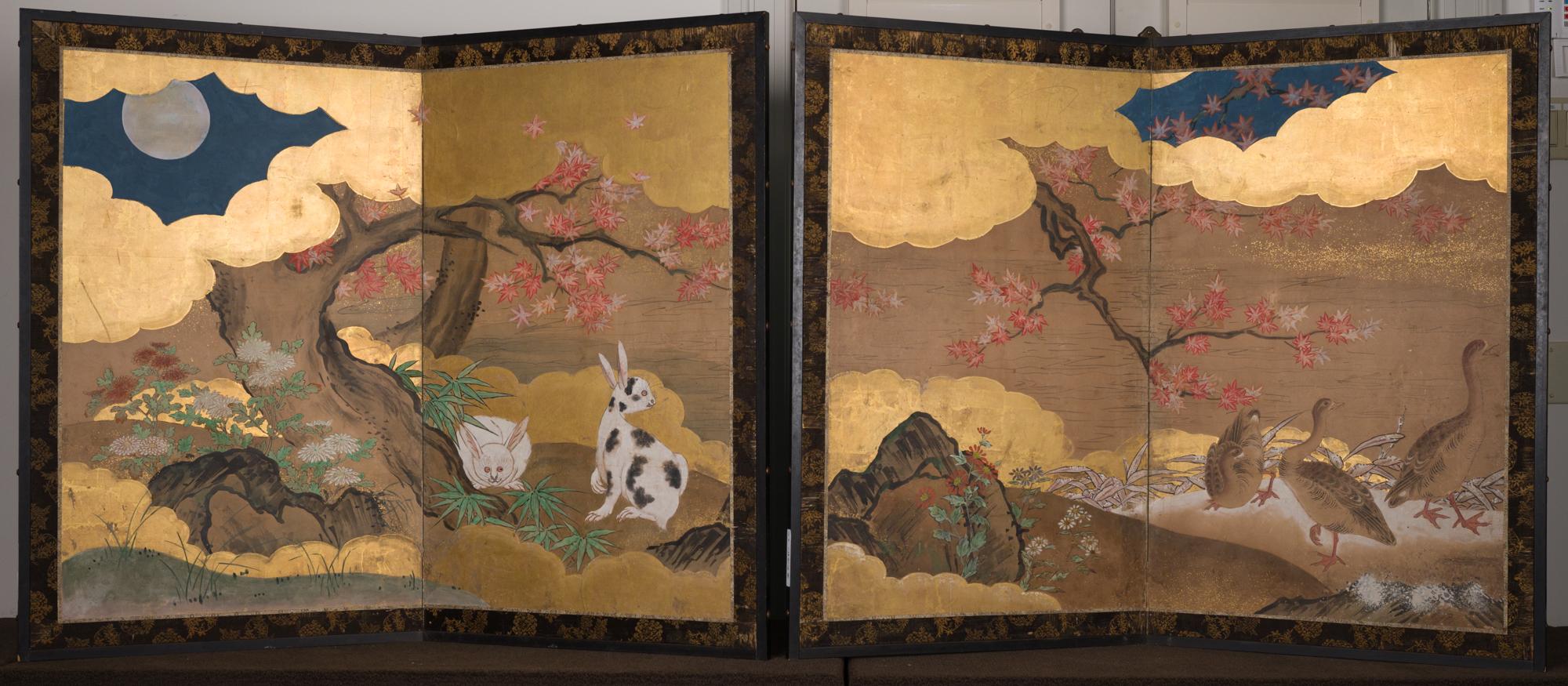 Screen A: Autumn Scene with Geese in a Gentle Landscape. Lovely painting depicting geese under maple, in a gentle water landscape. Mineral pigments on paper with gold leaf clouds. 
Screen B: Autumn Scene with Rabbits Under Maple in the Moonlight.