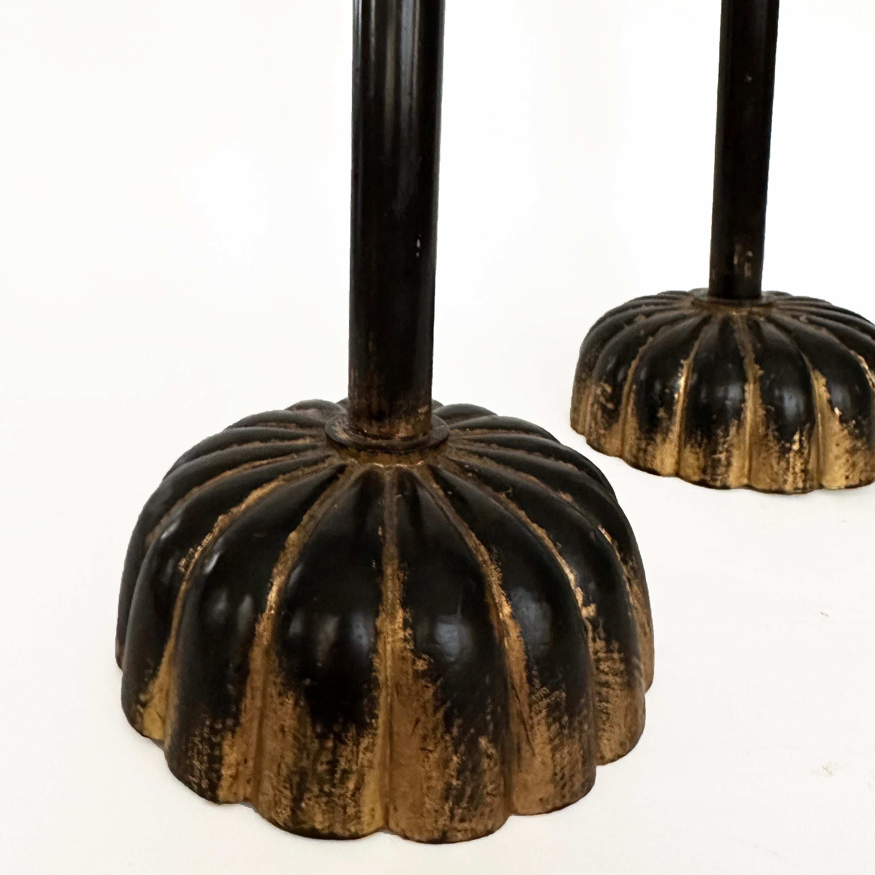 Pair of Japanese wood Shokudai with chrysanthemum shaped base, brass prickets and gold leaf

Shokudai or candlesticks are prevalent in homes and temples during the Meiji period and were necessary for illumination .  At present they are still in use