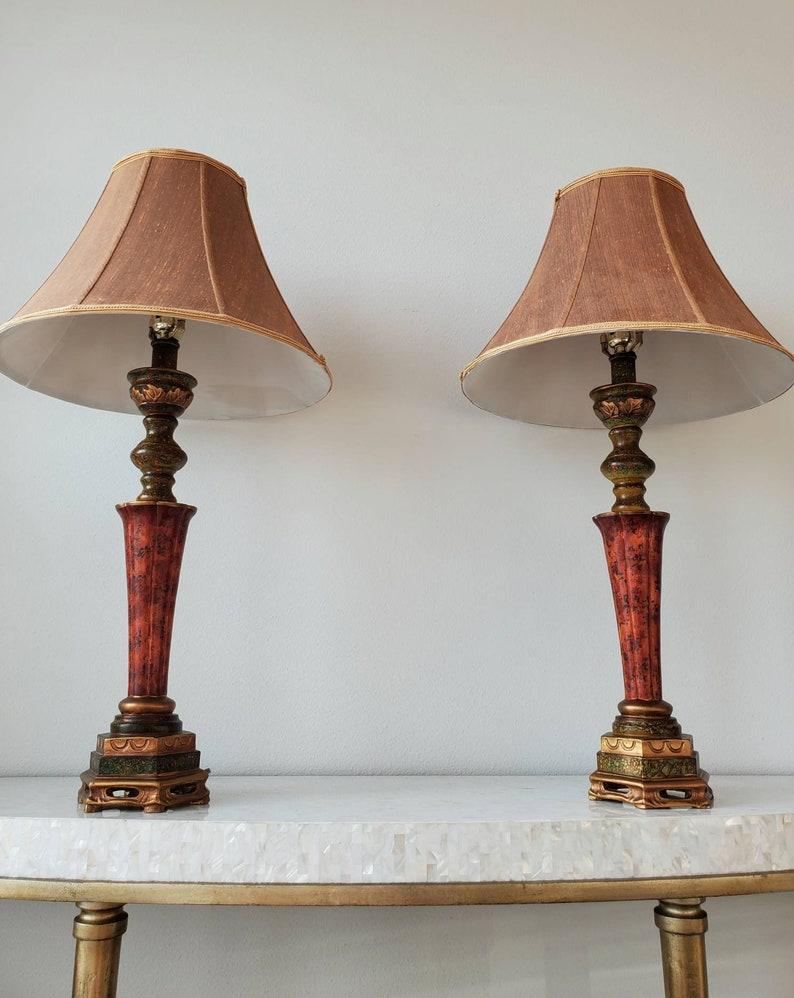 A matching pair of exceptionally beautiful contemporary table lamps by iconic American designer JB Hirsch. 

Excellent quality and craftsmanship, exquisitely stylized, finished in richly detailed vibrant polychrome decoration of faux applied