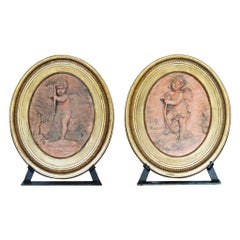 Pair of Jean Baptiste Vietty Oval Terracotta Bas Relief Cherub Plaques, Signed a