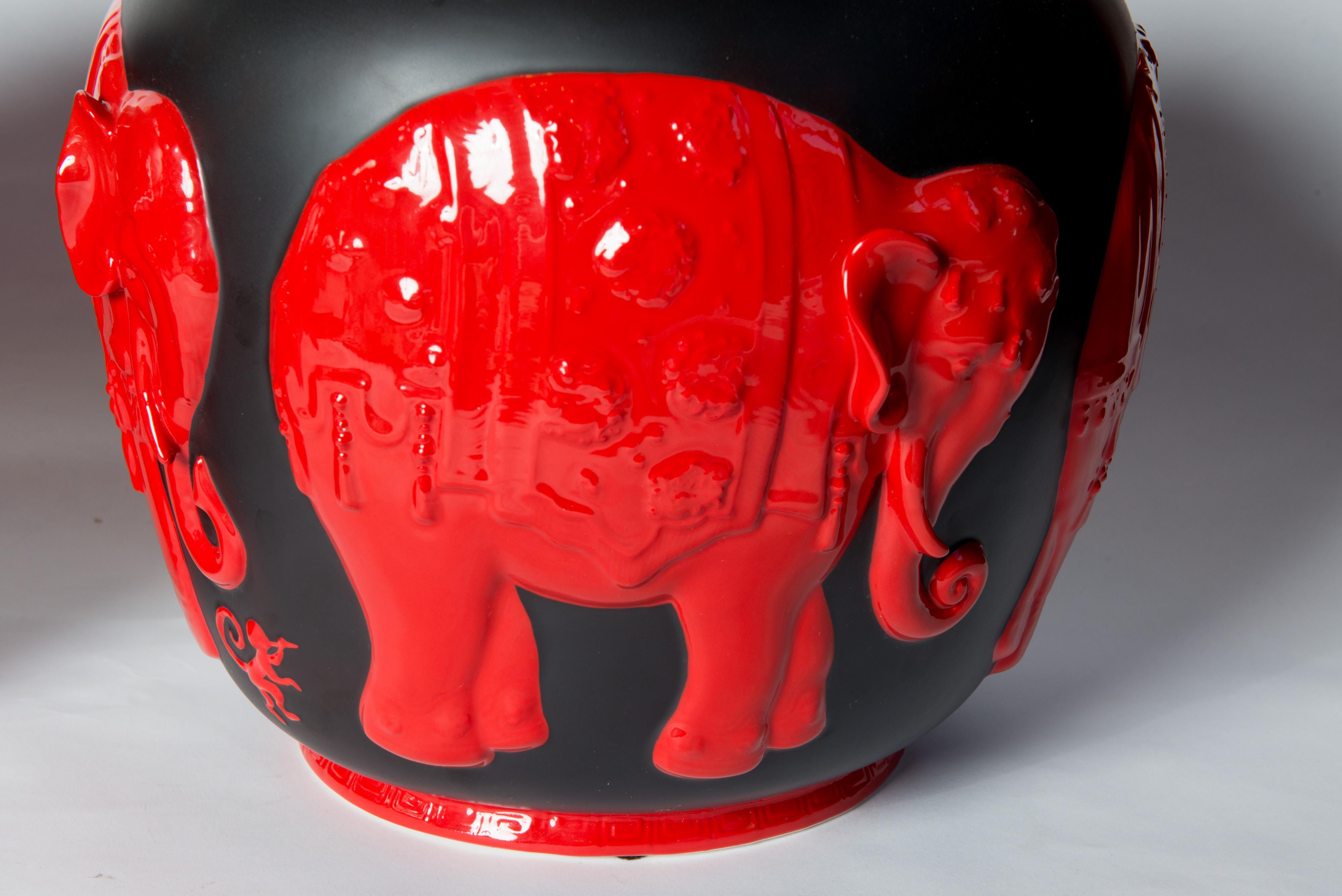 Pair of black and red ceramic elephant lidded ginger jars by Jean Boggio for Franz. Handmade and hand painted.