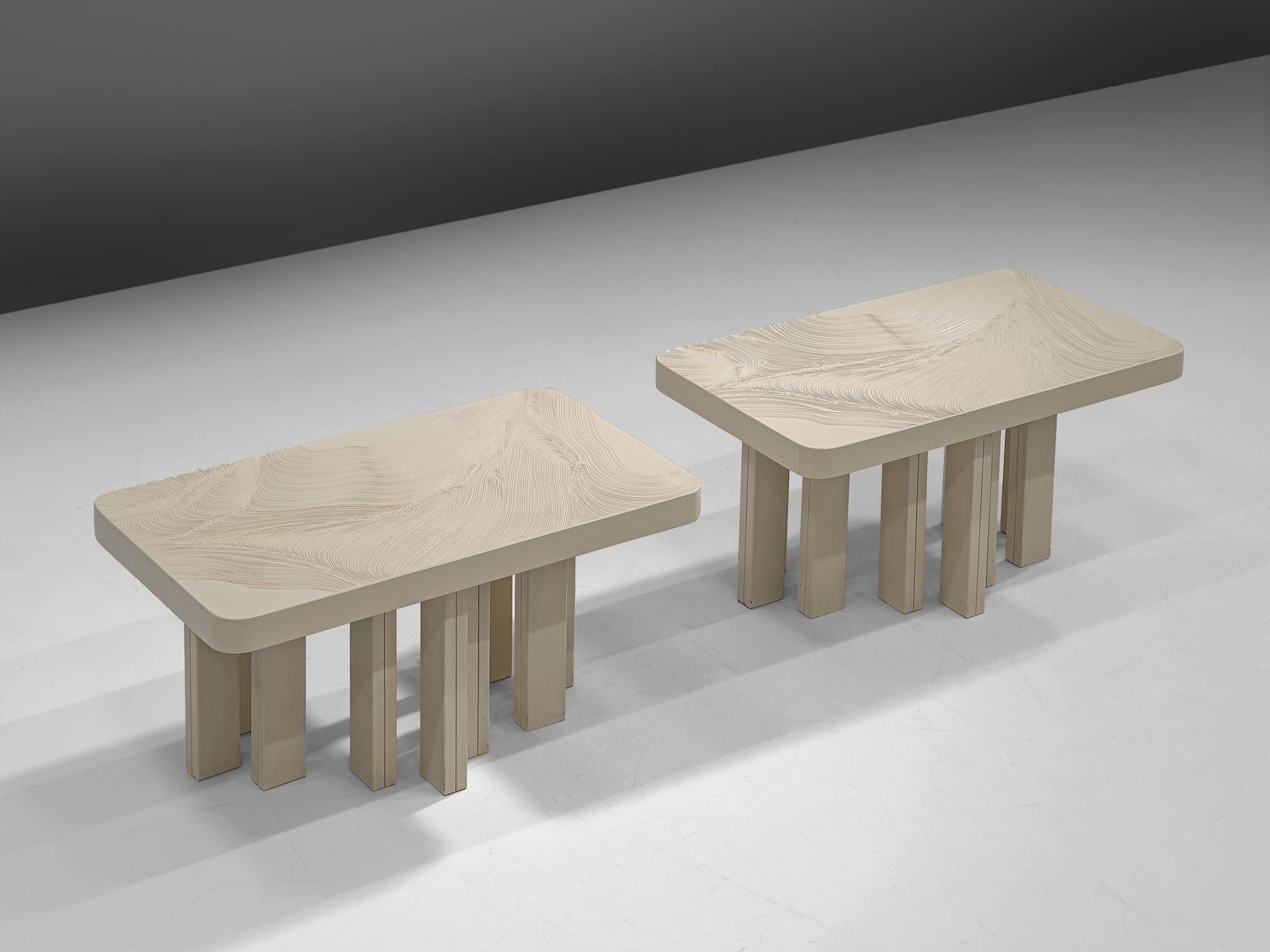 Jean Claude Dresse, pair of side tables, resin and steel, Belgium, 1970s

Elegant pair of coffee tables with a table top white resin, with an etched organic pattern visible in the top. The table top rests on a sturdy base executed in white lacquered