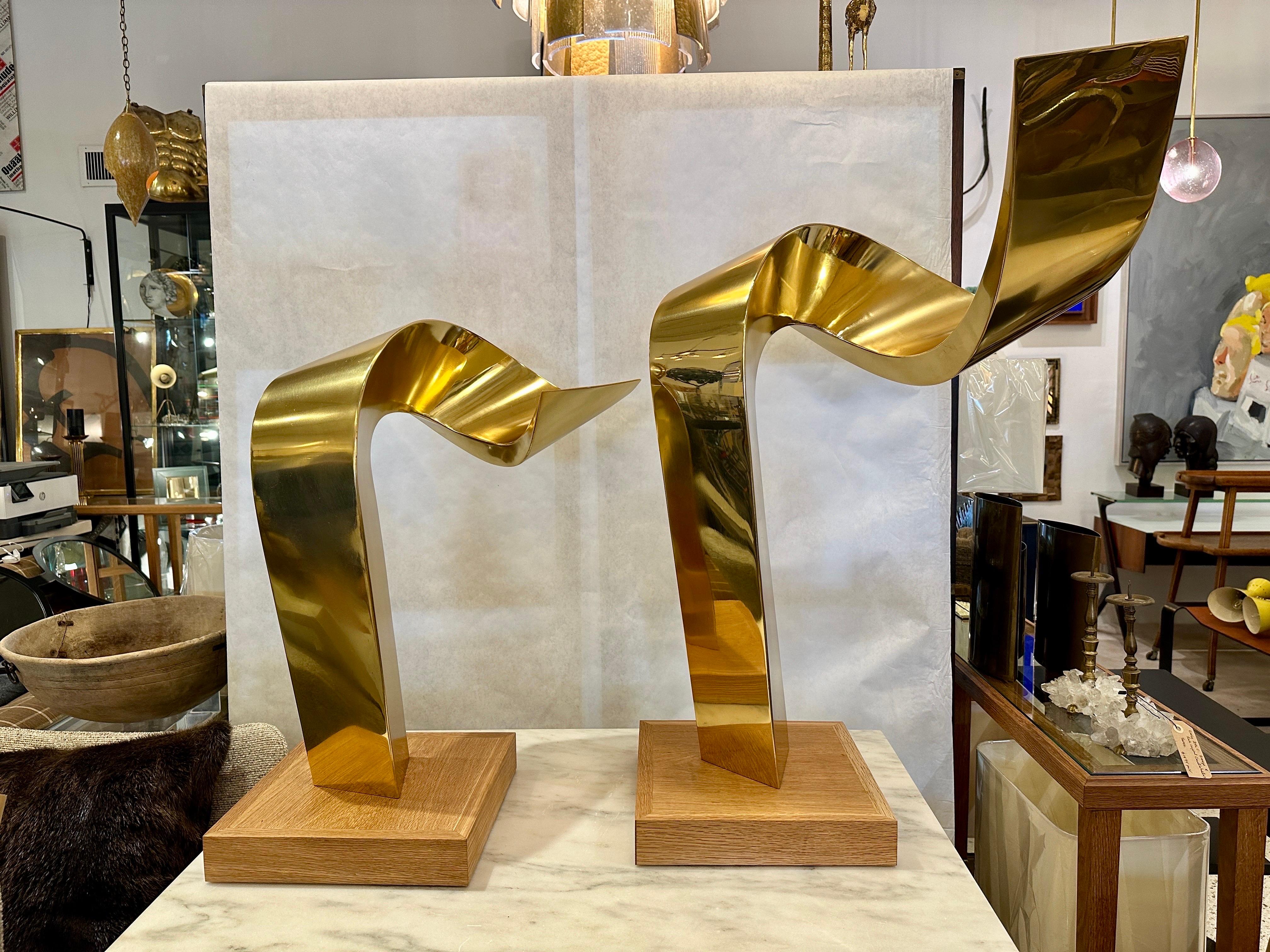 These wonderful tall free-standing abstract brass sculptures by Jean-Claude Hug, France (Born 1939), are being sold together.  HUG is known for metal work sculptures, these two curved brass pieces, can be displayed together or apart.  Signed 'J C